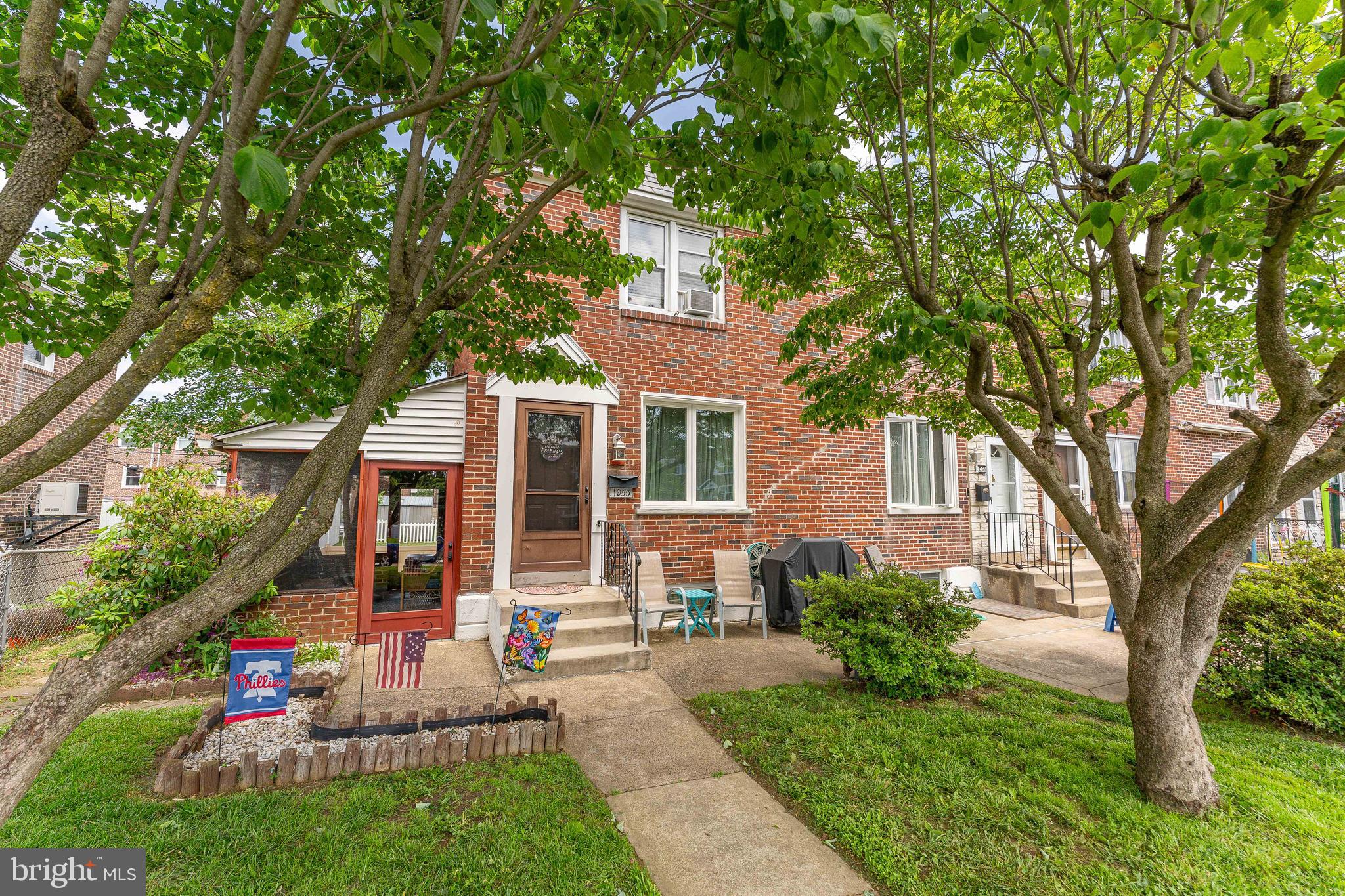 Welcome to 1053 Tremont Drive — a charming 3-bedroom, 1-bath end-unit row home located in the desirable Briarcliffe neighborhood of Glenolden. As you approach the home, you're greeted by a spacious screened-in front porch with a semi-vaulted ceiling and plenty of shade — the perfect spot for relaxing outdoors. With separate doors to both the front and backyard, this porch adds functionality and curb appeal, although it does not provide direct access to the home’s interior. Step inside the home to a bright and welcoming living room highlighted by gleaming hardwood floors, a large double front window, and a staircase with a convenient closet. An open layout leads into the dining room, which features hardwood flooring, a stylish chandelier, chair rail molding, and a double window overlooking the backyard — creating an ideal space for entertaining. You also have a back deck which is perfect for unwinding after a long day. The kitchen flows seamlessly from the dining area and offers vinyl flooring, granite countertops, a tile backsplash, chair rail detail, and two dome lights to brighten the space. Upstairs, the spacious primary bedroom features cozy carpet flooring, a ceiling fan with light, a generous walk-in closet, and a double window that brings in natural light. Two additional bedrooms on this level also include carpet flooring and ceiling fans with lights — perfect for kids, guests, or a home office. A full bathroom completes the second floor, equipped with tile flooring, a single-sink vanity, and a tub/shower combo. The lower level offers additional living space with a cozy family room featuring carpeted floors, warm wood-paneled walls, and a built-in hutch. Adjacent to the family room is the laundry area, which includes a washer and dryer, direct access to the attached 1-car garage, and a door leading to the backyard. The home also features a brand-new air conditioning system, installed in May 2025. Conveniently located near local shopping, grocery stores, Brookwood Playground & Park, and the Secane train station, this home offers both comfort and convenience. Don’t miss your opportunity to make 1053 Tremont Drive your new home!