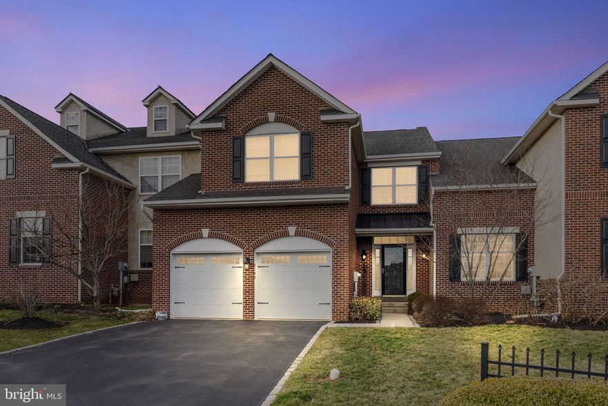 Welcome to 2143 Eastport Way, a beautifully maintained carriage home located in the highly desirable Biltmore Estates, right in the heart of charming Skippack Village. Situated on a premium lot, this home has been lovingly cared for and thoughtfully upgraded throughout.  As you enter, you’re greeted by a bright two-story foyer with a sunburst window and custom Venetian plaster finish. Hardwood floors run throughout the entire first floor, complemented by elegant crown molding that adds warmth and character to the main living spaces. The kitchen is both spacious and inviting, featuring upgraded cabinetry, granite countertops, and updated lighting—perfect for everyday living or hosting friends and family. The open layout flows nicely into the family room, where a cozy gas fireplace creates a comfortable gathering space. From here, glass doors lead outside to an impressive two-tier entertaining area with a large Trex deck and paver patio—ideal for relaxing or enjoying time outdoors. The main level also offers a living room, dining room, mudroom, and powder room, providing plenty of flexible space to suit your lifestyle. Upstairs, double doors lead into the primary suite with vaulted ceilings, a large walk-in closet, and a private bath complete with a soaking tub. Two additional generously sized bedrooms, a full hall bath, and a conveniently located second-floor laundry room round out the upper level. The partially finished basement adds even more usable space, whether you’re looking for a rec room, additional family room, or hobby area. There’s also a separate workshop with a built-in workbench—perfect for projects or storage.  Carriage homes in this community rarely come on the market, and the location can’t be beat.   The Biltmore Estates community offers low-maintenance living, manicured landscaping, and picturesque walking paths, all just minutes from Skippack’s beloved local cafés, boutiques, and acclaimed dining spots. Nature lovers will appreciate the nearby Perkiomen and Evansburg trails, leading to scenic parks like Palmer Park and Evansburg State Park—ideal for hiking, biking, and outdoor adventures.  Don’t miss the opportunity to make this wonderful home yours!