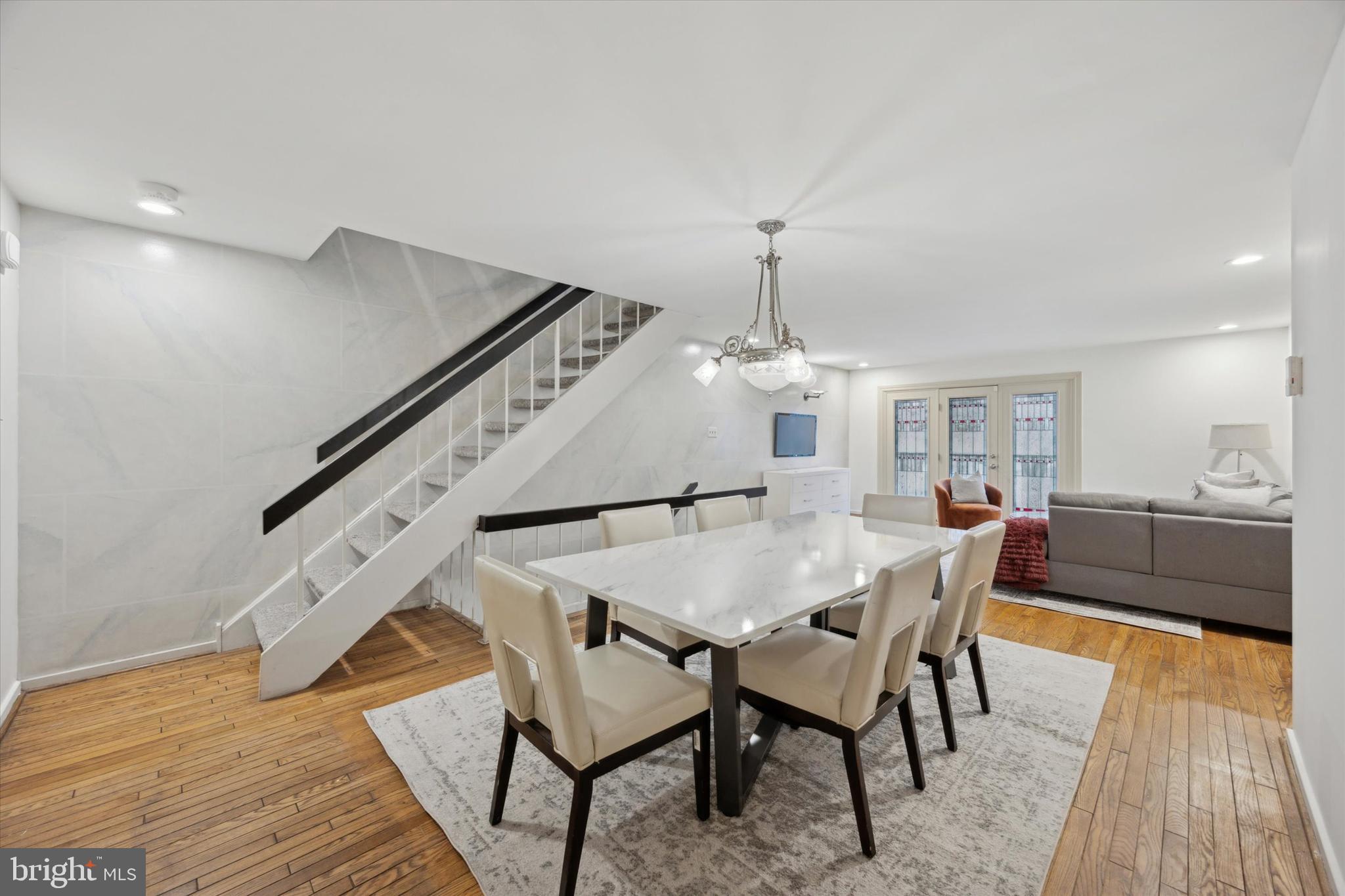 Welcome to 137 N 22nd St. This meticulously maintained home spanning 2,500+ sq. ft, is everything you need and more! Located in the Greenfield school catchment, this home features 4 bedrooms with an additional spacious loft, 3 Full Bathrooms, a powder room, and 3 outdoor areas. Pull into your GARAGE and enter through a tiled 1st floor. This light-filled entry level has a powder room, laundry area, and a large open den with a fireplace that leads to sliding doors onto a spacious patio. Make your way up to the main level with an open living and dining room with hardwood floors. The beautiful stained glass doors lead to a walkout balcony. Steps away is the stunning kitchen with an abundance of natural light featuring a cozy breakfast nook that can seat 6. Black cabinets and appliances complement the solid stone countertops and island perfectly. Head upstairs to 3 Bedrooms and 2 full bathrooms. The oversized primary suite on this level features a custom walk-in closet and a beautifully tiled bathroom with a shower. The 4th level oasis does not disappoint providing an additional spacious bedroom with custom closets, and a bonus room overlooking the 3rd-floor primary suite. Step onto the roof deck from this room for some fresh air. The huge custom bathroom features a full-size SAUNA, spacious shower, jacuzzi tub, and sitting area! 137 N 22nd St is convenient to all major highways. Walking distance to Trader Joe's, a new Giant supermarket, Whole Foods, The Philadelphia Museum of Art, Rittenhouse Square and so much more! Make your appointment today!