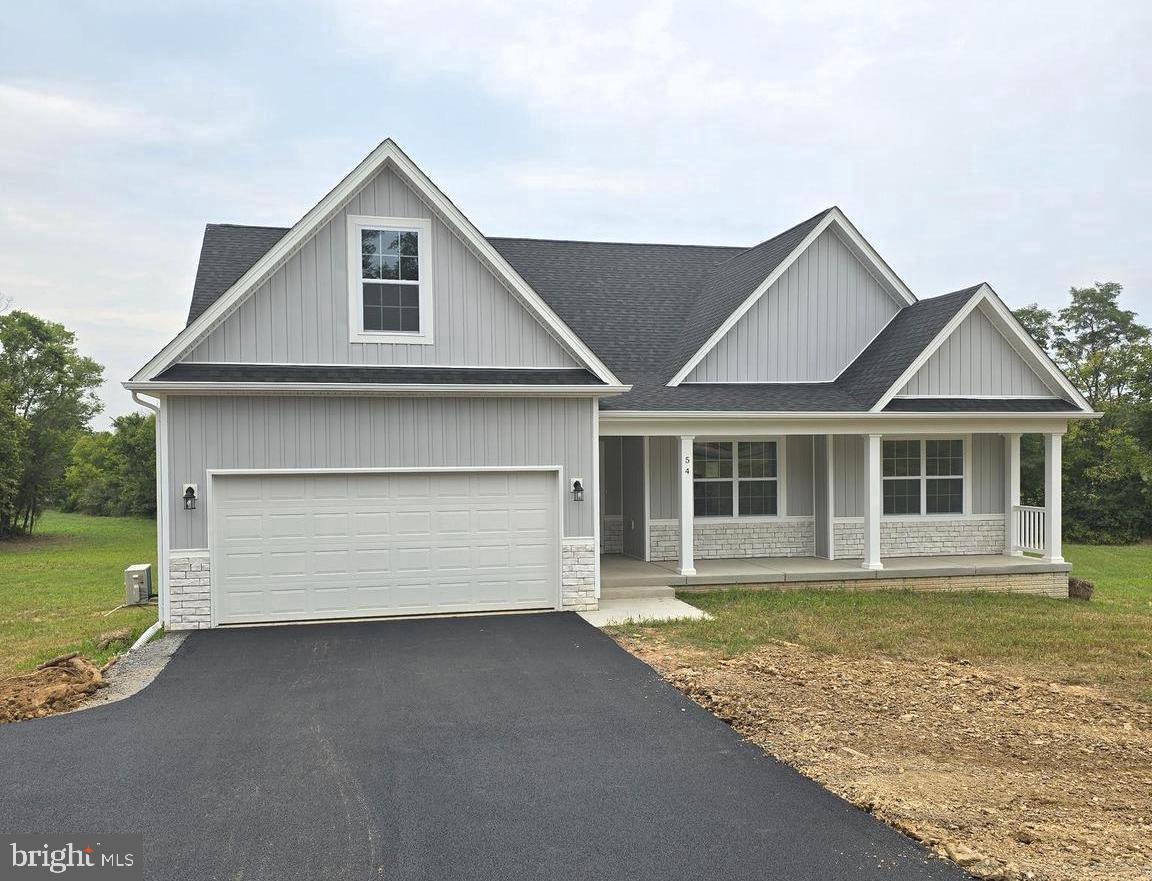 READY NOW REDUCED! Cambridge model with full front porch & walkout basement. This model features 4 bedrooms & 3 full baths. Full basement, stainless steel kitchen appliances, granite, luxury vinyl plank flooring, carpet, and more. Ideal setting, close to amenities. Experience quality and value with this builders finished product. Great commuter location. Photos are actual as shown. Your 2.01 +/- acre home is located in a desirable area close to Charles Town and surrounding areas. No need to wait. Take advantage of this home today! Check out the virtual tours.