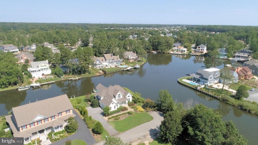 Dock your boat at this charming waterfront home bordering water on 2 sides. Convenient features include a first floor master suite, an open and airy great room,  and a bonus room.  Enjoy panoramic water views and only minutes to Rehoboth Bay!
