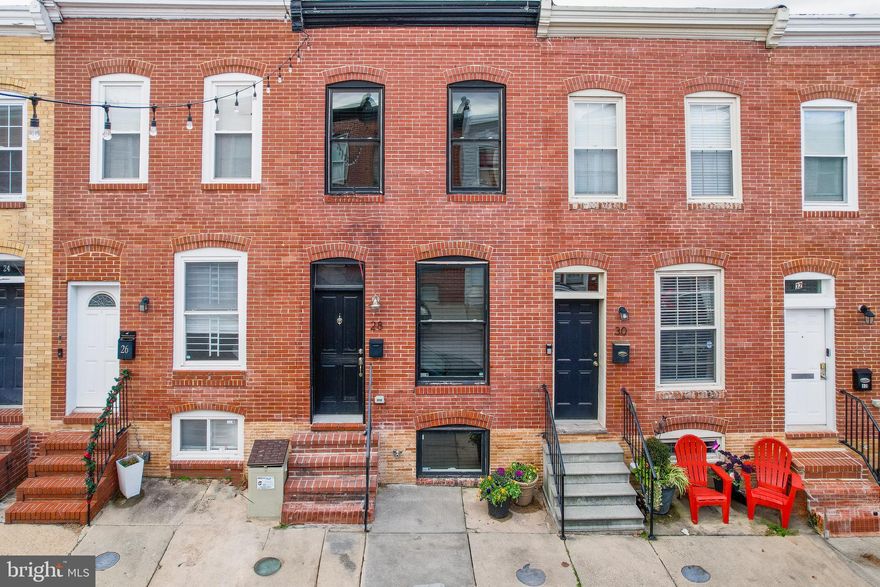 Welcome to 28 N Curly Street, a beautifully renovated 1920s home offering 3 bedrooms and 2 baths across 1404 sq ft. With hardwood floors, stainless steel appliances, and a fully finished basement, this residence seamlessly combines historic charm with modern comfort. The property boasts excellent condition with significant renovations in 2013. Enjoy designated outdoor space for parking or create your own outdoor retreat. Located on a quiet one-way street, just steps from Patterson Park, and within walking distance to downtown amenities. No HOA fees, SMART features throughout, a jetted bathtub, exposed brick, and a bonus flex room add to the appeal. Don't miss the chance to call this Baltimore gem home!