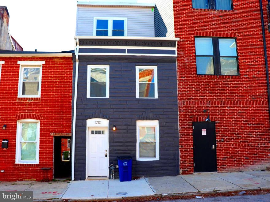 Discover an exceptional urban retreat at 1710 Light Street, a completely reimagined luxury townhome in the heart of Federal Hill. Fully remodeled with all permits pulled and finalized, this residence offers a refined blend of modern sophistication, thoughtful design, and premier city living—where every detail has been carefully curated.

Boasting 3 bedrooms, 3.5 bathrooms, and an intelligently designed multi-level floor plan, this home is equally suited for elegant entertaining and everyday comfort.

Elevated Interiors & Thoughtful Design

The first level welcomes you with a spacious family room, dining area, and a beautifully appointed open-concept gourmet kitchen. Designed as the heart of the home, the kitchen features sleek cabinetry, stainless steel appliances, expansive counter space, and a statement island, ideal for both casual mornings and elevated gatherings. From here, step into the private covered patio, a rare, rainproof outdoor space perfect for year-round entertaining—add lounge seating, a TV, or create your own outdoor living room.

The second level offers a versatile layout with a private guest or “princess” suite featuring its own full bath and walkout deck, a third bedroom, an additional full bathroom, and a conveniently located laundry room—providing comfort, privacy, and functionality.

The third level is dedicated to the primary suite, a true sanctuary complete with a walk-in closet and spa-inspired ensuite bath. Just outside the suite, a wet bar and half bath create the perfect prelude to the showpiece rooftop deck, where panoramic skyline views set the stage for sunset cocktails, entertaining under the stars, or quiet moments above the city.

Exceptional Outdoor Living

Private covered patio (rainproof and entertainment-ready)

Expansive rooftop deck with breathtaking Baltimore skyline views

Prime Federal Hill Location

Set along iconic Light Street, this home places you moments from Federal Hill Park, Cross Street Market, the Inner Harbor, waterfront activities, stadiums, and some of Baltimore’s best dining, nightlife, and boutique shopping. With easy access to public transportation and major commuter routes, the location is as convenient as it is vibrant.

Why You’ll Love It

This is more than a home—it’s a lifestyle. With brand-new systems, upscale finishes throughout, and a layout designed for modern urban living, 1710 Light Street offers turnkey luxury in one of Baltimore’s most desirable neighborhoods.

Whether you’re a discerning city professional, a design-forward buyer, or an investor seeking a premium asset, this residence is a rare opportunity.

Schedule your private tour today and experience Federal Hill luxury at its finest.