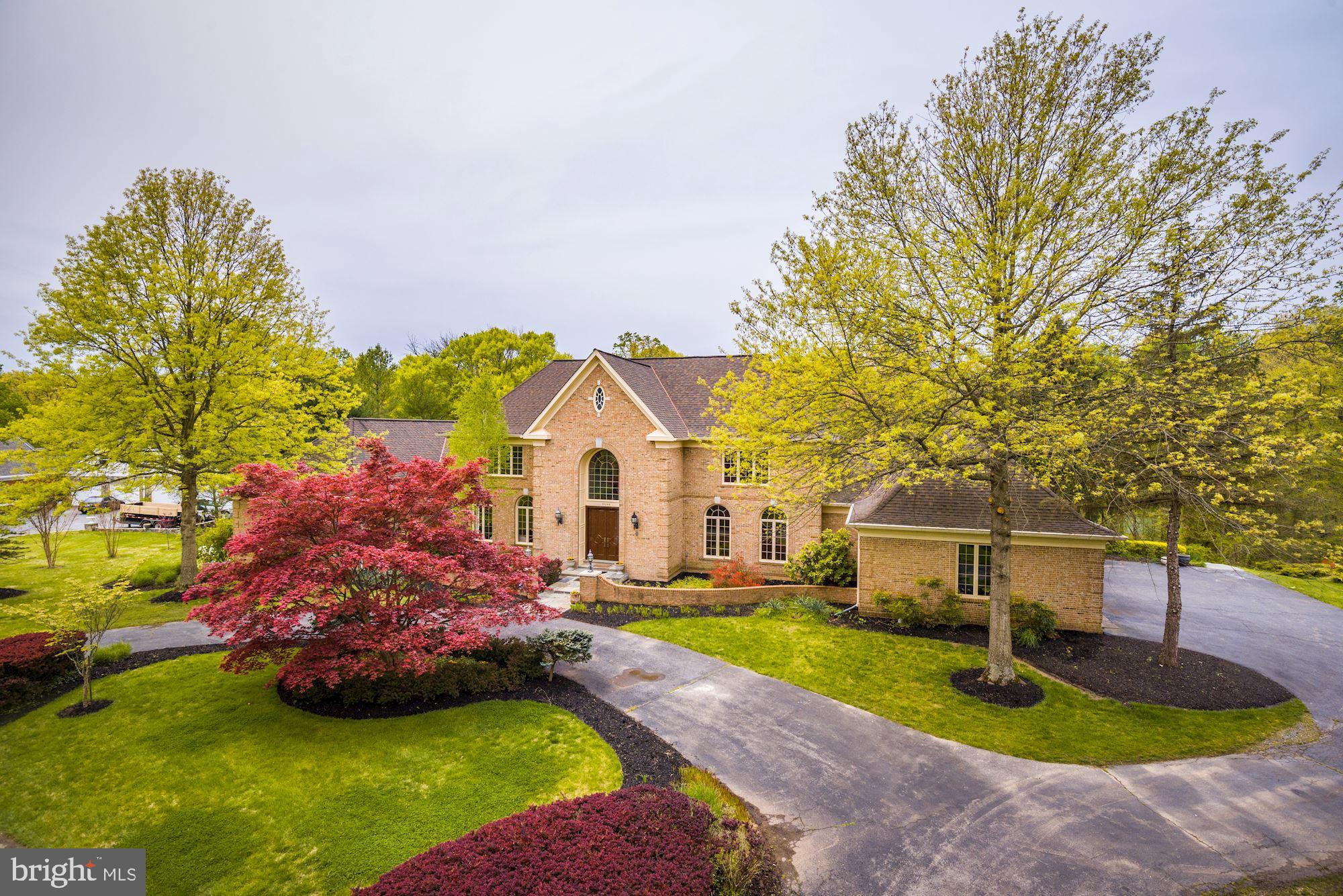 NEW PRICE! PICTURE PERFECT BRICK COLONIAL ELEGANTLY SITED ON A QUIET, PRIVATE 2+ ACRE LOT IN THE HEART OF POTOMAC! This sensational 8 bedroom and 6 full/2 half bathroom estate home with modern flair boasts 11,646 sq ft of total finished space, a 3-car garage, and features a multi-functional, open floor plan with 3 fireplaces that is ideal for both full scale entertaining and comfortable family living. From the dramatic 2-story family room with a wall of floor-to-ceiling windows to the terrific gourmet island kitchen with luxury finishes and adjoining breakfast area and all-season sunroom addition, this distinctive home reflects great pride of ownership. A deluxe master bedroom suite on the main level is complete with a vaulted ceiling, separate sitting room with custom built-in cabinetry, 3 walk-in closets, and 2 luxurious his-and-hers marble bathrooms while the upper level has 4 spacious bedrooms sharing 2 Jack and Jill bathrooms with double sinks and tub/shower combinations. The enormous fully-finished walk out lower level is enhanced with another guest bedroom and living, recreation, and game rooms as well as a 2-bedroom guest suite with a kitchenette and 2 full bathrooms. Both an expansive wrap-around outdoor deck, stone patio with bar, swimming pool, and tennis court provide for resort-style living with spectacular views of the secluded, wooded backyard. Major improvements include an $80K all-season sunroom addition, 2 new HVAC units and furnaces, and entire roof and family room window replacement. Contemporary, secluded living in a tranquil setting, ideally located only minutes to Bethesda and the interstate corridor.