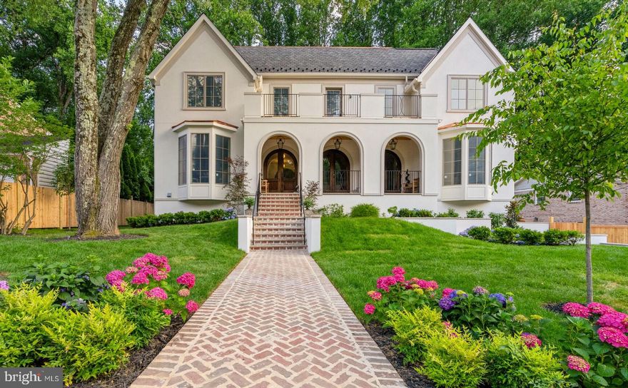 Nestled in prestigious McLean, Virginia, one of the DMV’s most sought-after neighborhoods, this home blends suburban tranquility with urban convenience. This custom residence offers luxury, functionality, and exquisite craftsmanship in a premier location.
 
Upon entering through the arched porch and Mahogany doors, the grand foyer with Solid White Oak Versailles parquet sets the tone for the home's special character. The living room features a Louis XV Carved Marble fireplace mantel with a gas insert, and the family room boasts a hand-restored antique Empire wood mantel. The dining room is adorned with a custom wallpaper mural, and the main floor library/office includes wall-to-wall built-ins.
 
The gourmet kitchen features custom painted maple and stained red oak cabinets, soapstone and marble countertops, and top-of-the-line appliances, including Subzero, Wolf, and Bosch appliances. The back kitchen and butler’s pantry include additional appliances and specialized sinks. Lighting fixtures blend modern and antique styles, including Louis XV Rococo bronze sconces and various high-end brands throughout. Off the family room, discover a private backyard brick patio garden, with covered and uncovered spaces, a neatly manicured landscape and privacy fencing.
 
Upstairs, the Owner’s suite has coffered ceilings, a Brazilian teak terrace with backyard views, and a luxurious bath with a freestanding tub, double vanity, marble tiles, and spacious walk-in closets. Three additional bedrooms with ensuite baths and an upper-level laundry complete the 2nd level, while the 3rd level features a loft, bar, 5th bedroom, and full bath.
 
The lower level includes polished concrete flooring, recreation spaces, an insulated wine cellar, a bar, and a fireplace. Find the 6th and 7th bedrooms, one with an ensuite bath, offering guest and au-pair accommodations. The lower level also has separate access to the 2-car garage, making all points DMV just moments away.
 
Additional features include Pella windows, custom vanities in all baths, and marble and porcelain tile floors in select areas. The home includes two laundry zones, a herringbone pattern for walkways and patios, an elegant stucco exterior, and Bevolo Gas Lanterns lighting the entry. Smart Home features include a Sonos system, Ring doorbell, Nest thermostats, tankless water heaters, Wi-Fi repeaters, and direct Ethernet connections. The home has four zones of heating and cooling for efficient climate control and was engineered to allow for a 4-floor elevator (optional).

Video link: https://youtu.be/YB4Rhwex7kQ?si=kHeIuEp0FllWkiSE