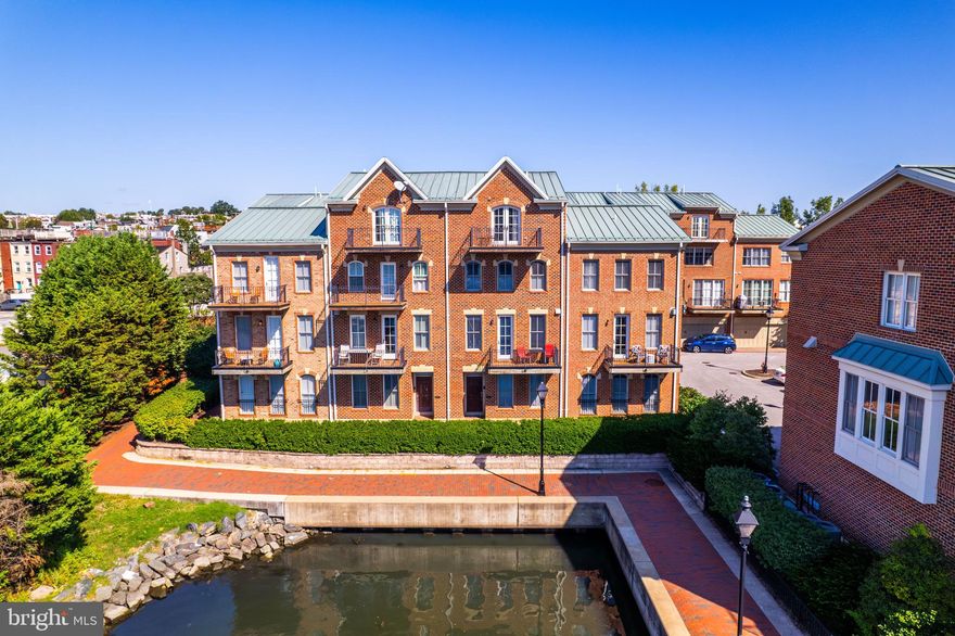 Welcome to North Shore a Sought after Community located on the Canton Waterfront.  Situated between fells and Canton.  This 3 Bedroom 3.5 Bath Waterfront Townhome offers a 2 car garage with one extra space.  The first level as you enter has a flex space, can be used as an office guest bedroom workout room etc. open entry Full bath and closet space and access to the garage. As you enter the main living area, The gourmet kitchen is a chef's dream with Viking appliances and a kitchen island for entertaining your guests. Open the balcony door and have outdoor space overlooking the water.  This open-concept living and dining area are bathed in natural light, enhancing the inviting and airy feel of the home.  A half bath is located on the main level for your guest. As you enter the 3rd level you will find a 2nd living area full bath and 2nd  bedroom.  laundry is located on this level.  4th level is the Primary Suite with private balcony, his and hers walk in closets, his and hers sinks,  jacuzzi and an oversized shower.  Come check out this Waterfront Oasis .  Located near parks restaurants, and shops steps to fells point and O'Donnell Square.   Close to major highways, top hospitals.  Experience living like you are on Vacation everyday.