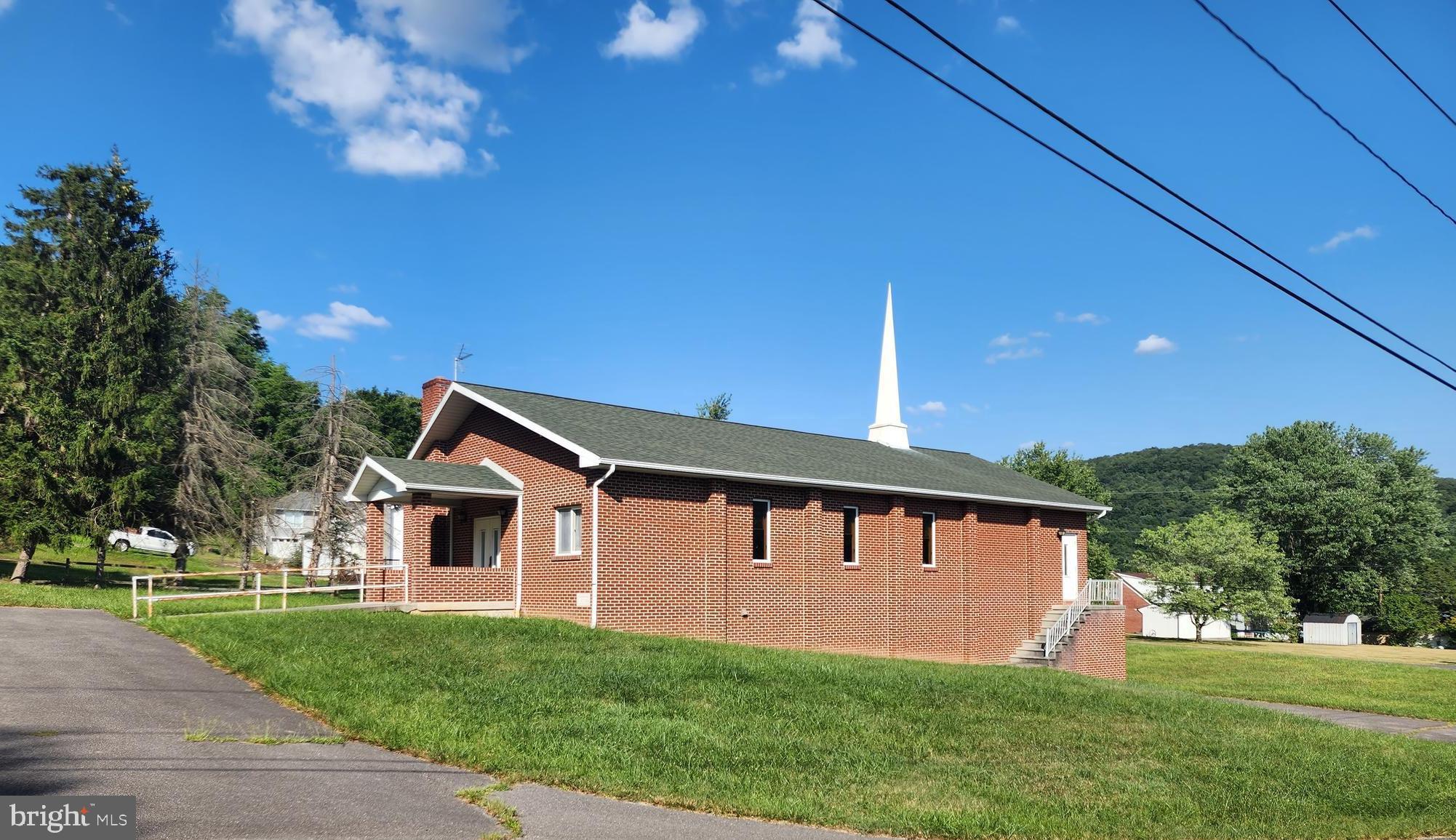 Located in the heart of LaVale, prime residential land currently with a church building containing 2,280 sf on main level with similar sf in lower level, working kitchen, office space and storage, property is currently used as exempt commercial within a residential zoning area, ample parking, large vacant parcel on separate tax account, turn key currently or can be used for residential application. 2 parcels totaling 2.9 acres.