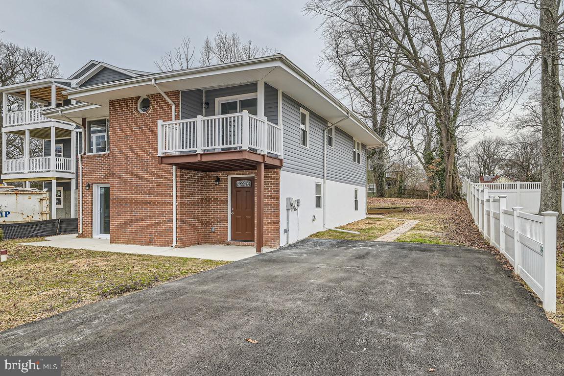 Fully Renovated House with Limited Water View in Desirable Arundel On The Bay. Nestled just steps from the Bay, this fully renovated house offers a modern and open floor plan perfect for contemporary living.
The main level features a spacious living and dining area with a cozy electric fireplace, creating an inviting atmosphere for both relaxation and entertaining. The brand-new kitchen boasts 42" cabinets, quartz countertops, and stainless steel appliances. A convenient laundry area is also located on the main floor. Upstairs, you'll find three generously sized bedrooms, a cozy sitting area with large windows that allow natural light to fill the space, and a den with sliding doors leading to a front deck. The den could easily be converted into a fourth bedroom if desired. Recent upgrades include all-new windows and doors, new roof, new siding, new HVAC system, new hot water heater, and new well equipment. Enjoy the tranquility of living on a quiet street, just a block from the water, and within walking distance of the public beach at the end of the street, and short drive from Annapolis. This home is the perfect blend of modern updates and prime location, offering everything you need for comfortable living by the water.