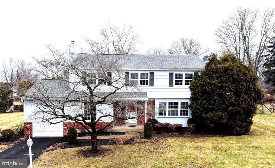 Bring your vision to this classic 2,188-square-foot colonial, positioned on a sprawling .46-acre corner lot in New Britain Borough and the highly sought-after Central Bucks School District. This four-bedroom, 2.5-bath single-family home offers the ideal canvas for homeowners and investors looking for property in Bucks County.
The main level is designed for both comfort and connection, featuring an eat-in kitchen with a functional peninsula that flows into an adjoining dining room for holiday hosting. A cozy den anchored by a traditional wood-burning fireplace offers a quiet space, near the laundry area.  
The second floor continues to impress with a primary suite featuring a private full bath and walk-in closet, alongside three spacious bedrooms with original hardwood floors. The bathrooms showcase vintage tile work that is ready to be enjoyed as-is or modernized to your specific taste.  Practical storage solutions like a dedicated linen closet and hall walk-in closet are added features to this home.
Outside, you can enjoy the fresh air from the screened-in porch overlooking the nearly half-acre lot, ready for outdoor activities and entertainment. The property also includes a one-car garage and a full unfinished basement equipped with a workbench and built-in shelving.
The mechanicals have been well-maintained and are in working order, serviced by public utilities and  natural gas. This location is minutes from Delaware Valley University, Penn Medicine Doylestown Health, and historic Doylestown shops. While this home is ready for a refresh, its "good bones" and generous floor plan make it a rare find.  
Join us for public open houses on Thursday, March 12th, and Thursday, March 19th, from 3:00 PM to 5:00 PM.  This property sells at public auction on Tuesday, March 31st at 4:00 PM.