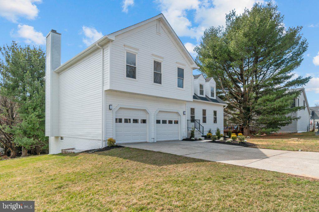 Stunning High-End Renovation in the Sought-After 21209 Zip Code! This beautifully updated single-family home features 4 bedrooms, 3.5 baths, and a spacious, open layout designed for modern living. The gorgeous kitchen boasts stainless steel appliances, granite countertops, an island, and flows seamlessly into the family room with a cozy fireplace. Luxury vinyl plank flooring runs throughout, complementing the recessed lighting and ceiling fans in each bedroom. Upstairs, you'll find all four bedrooms, including a luxurious primary suite with a sitting area, walk-in closet, and a spa-like en-suite bath. The convenience of a second-level washer and dryer makes laundry effortless. The finished basement offers endless possibilities with a full bath, sliding glass doors to the outside, and ample space for a home gym, movie lounge, or recreation area. Outside, the home features a spacious driveway and a large two-car garage. A must-see home in an unbeatable location!
