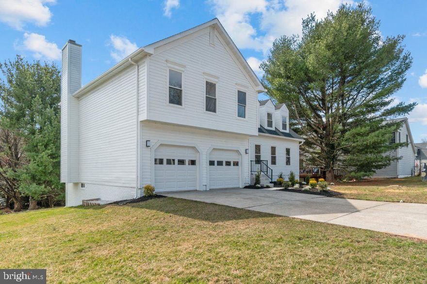 Stunning High-End Renovation in the Sought-After 21209 Zip Code! This beautifully updated single-family home features 4 bedrooms, 3.5 baths, and a spacious, open layout designed for modern living. The gorgeous kitchen boasts stainless steel appliances, granite countertops, an island, and flows seamlessly into the family room with a cozy fireplace. Luxury vinyl plank flooring runs throughout, complementing the recessed lighting and ceiling fans in each bedroom. Upstairs, you'll find all four bedrooms, including a luxurious primary suite with a sitting area, walk-in closet, and a spa-like en-suite bath. The convenience of a second-level washer and dryer makes laundry effortless. The finished basement offers endless possibilities with a full bath, sliding glass doors to the outside, and ample space for a home gym, movie lounge, or recreation area. Outside, the home features a spacious driveway and a large two-car garage. A must-see home in an unbeatable location!