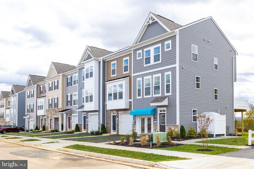 The only community within historic Charles Town with resort style amenities!
**Cover Your Closing Cost Up To $10,000, Paid by DRB Homes and Lender Credit for Primary Residence with Use Of Approved Lender and Title!**
**MODEL HOME FOR SALE** Your chance to own an End Unit model home in the only community in Charles Town with resort style amenities! This 3 level Darlington II town home features 3 bedrooms, 3.5 bathrooms, 9ft ceilings and a 1 car garage with driveway. This home is full of beautiful upgrades including custom paint and trim work throughout the home, a 4ft rear extension, upgraded flooring and lighting throughout, tray ceiling in the primary suite, vaulted ceilings in secondary bedrooms, upstairs laundry room complete with washer and dryer, a rear 8x12 composite deck and a fireplace in the family room. This gorgeous open kitchen is complete with an island that extends over 8ft, upgraded cabinets, Quartz countertops, an apron sink and pendant lights. Live the Huntfield lifestyle in Charles Town's largest planned community ideally situated along the rolling hills of the Blue Ridge Mountains!