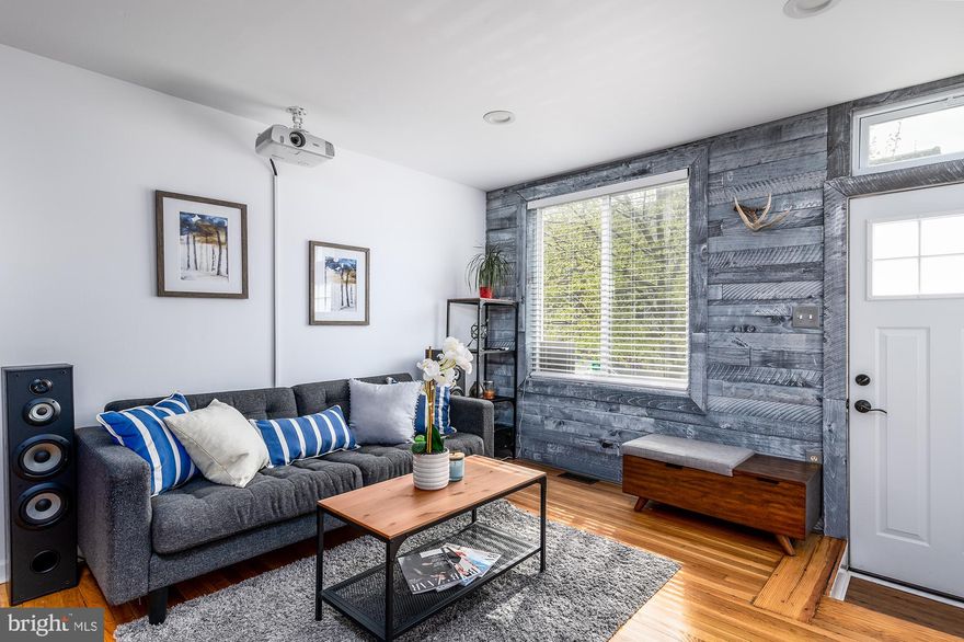 Welcome to 213 S Eaton, fully updated  Highlandtown townhouse, on a extra deep land lot with your own zen-garden and a garage. The house welcomes you with an inviting living room with a Ben-Q Short Throw projector (all equipment stays with the house) for your movie nights or music video display, reclaimed wood accent walls, original central staircase and a fully renovated kitchen with shaker style cabinets, custom marble backsplash, large island with granite counters and stainless appliances. Second floor offers two large bedrooms and a fully renovated bathroom with Italian natural carrara marble tile, walk in shower with glass doors, and custom vanity. Lower finished level is perfect for a den, office or a guest quarters with a complete full bathroom. High Efficiency HVAC, water heater, appliances, new garage door and a new garage raised roof completed within last 3 years, membrane main house roof is 1 year old. Enjoy your green space with all of the fruit-bearing trees, perfect for family gatherings and cookouts. Close to Canton, succulent Patterson Park, Fells Point, Harbor East, close to I-95 and Baltimore downtown, perfect location if you are commuting to DC.