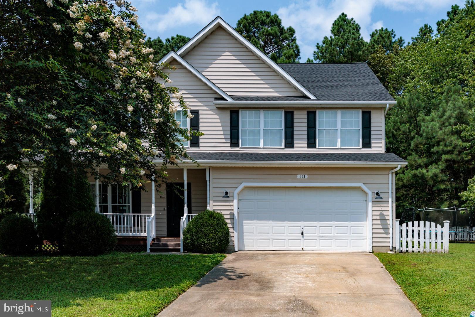 Tucked away in the serene Greenwood Subdivision, this beautifully maintained 4-bedroom, 2.5-bath home offers comfort, space, and privacy on a generous sized lot in one of the area's most desirable neighborhoods. Step inside from the cozy front porch to find fresh paint, gleaming hardwood floors, and a bright, welcoming layout. The kitchen features stainless steel appliances, perfect for both everyday living and entertaining. Upstairs, brand-new carpet has been installed in all bedrooms, including a spacious primary suite complete with a whirlpool tub and walk-in closet. New roof installed summer 2024. Cozy up by the gas fireplace in the family room or enjoy the outdoors on the large rear deck overlooking a fully fenced backyard—ideal for pets, play, or quiet evenings. This home is move-in ready and offers the perfect blend of comfort and seclusion, all within a well-established and peaceful neighborhood. Great school system and close to Bay Bridge!