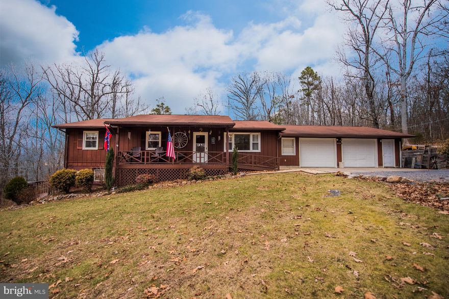 Private, 2-Level Home off Paved Roads with Rear Yard bordering George Washington National Forest. 4 Bedroom//2 Bathroom with Living Space, Entrances, Bedrooms, and Bathrooms on Both Levels. Perfect for Full-Time Living or Weekend Home! Ramp Access to Front Porch / Main Entrance and Laundry in Garage on Main Level. 2 Koi Ponds (Fish Convey) in Rear Yard. VIEW VIRTUAL TOUR!