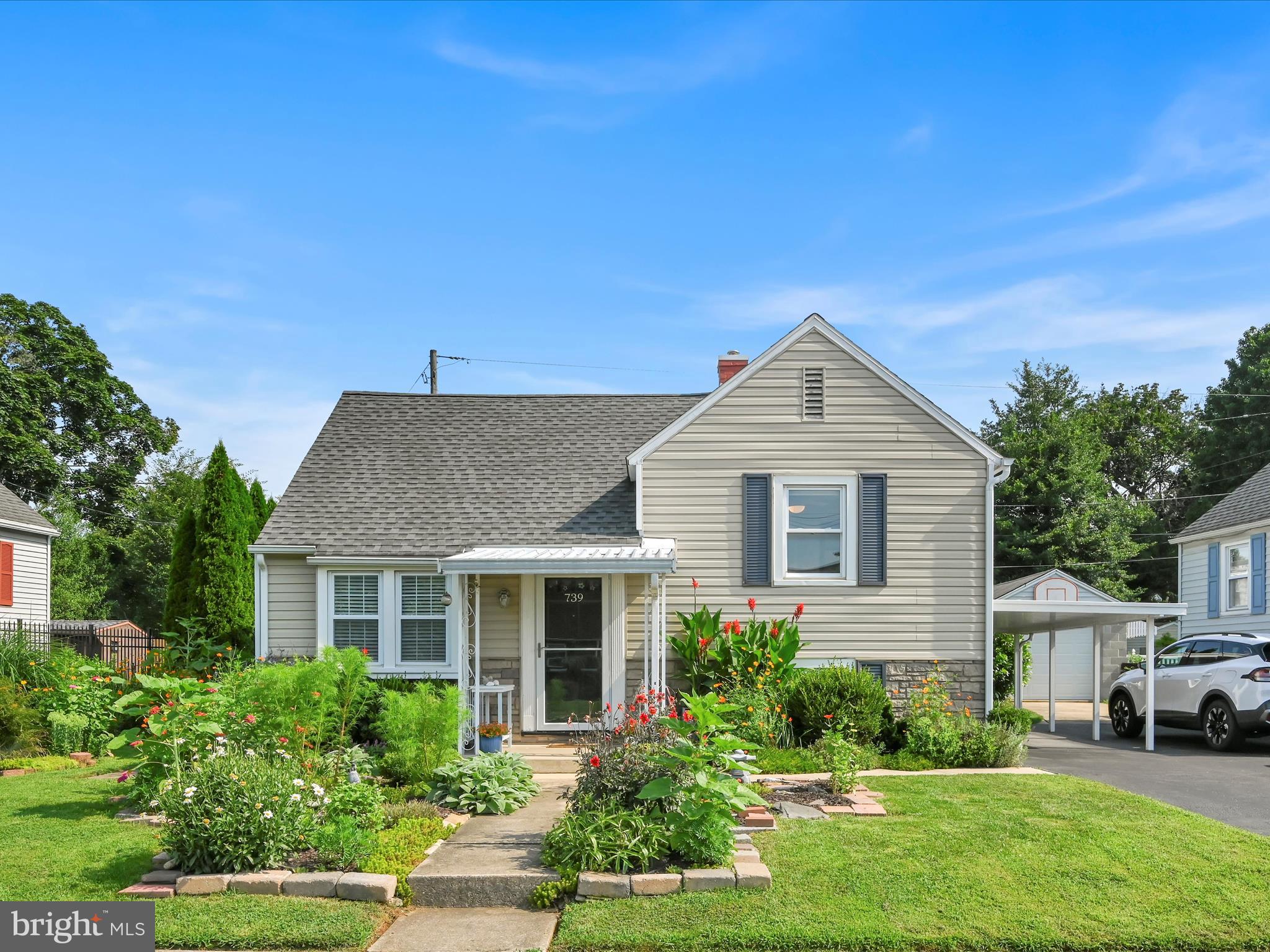A Jewel to Behold! This quaint split-level is bursting with quality, charm and character - both inside and out! As you enter you'll notice the lush plantings along the walk and in the yard. Once inside you'll be surprised by the refined beauty of the LR and Kitchen. Each space welcomes you home. The HW floors provide the right tone and enhance the feel of this updated 1950's home. Up the first half-flight are two BR's sized "just right" and a full bath. Up another half-flight and you'll find a large BR/Workroom/Craftroom/Office. Head down a half-flight from the LR and you'll find a tidy laundry area, plus an area used for storage and hobbies - BUT could easily be transformed into a Family Room (it already has a decorative FP). In the rear yard is a spacious deck overlooking a garden paradise. The owner lovingly selected and planted the space to transfer a plain-jane backyard into something special. Replacement windows, New Central A/C (2024), New Gas Hot Water Heater (2019). Come see for yourself and fall in love!