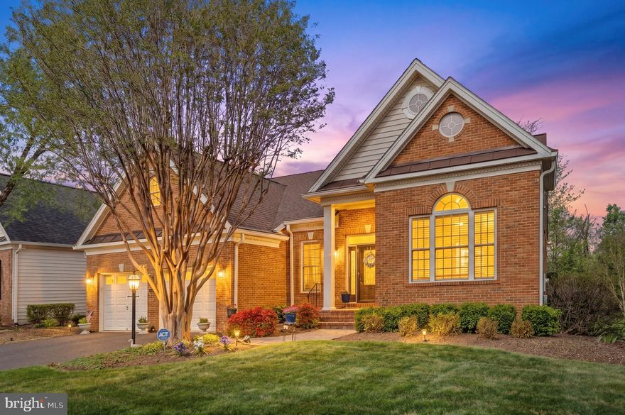 Welcome to this beautifully maintained Bayhill model by Toll Brothers, perfectly positioned on a quiet cul‑de‑sac in the sought‑after 55+ community of Regency at Dominion Valley. Designed for effortless main‑level living, this 2003 home offers two main‑level bedrooms, two full baths, fresh interior paint, and an inviting open layout filled with natural light. Hardwood floors connect the spacious kitchen, breakfast area, and great room, while a formal dining room provides an elegant setting for gatherings. A versatile main‑level den adds flexibility for a home office, library, or hobby space.

A standout feature is the custom sunroom addition, offering year‑round comfort with heated floors, designer plantation shutters, and serene golf‑course views—an ideal spot for morning coffee or quiet relaxation. The owner’s bath was tastefully remodeled in 2015, and the guest bath was updated in 2025 for added convenience and modern appeal.

Step outside to a private deck backing to the golf course, offering peaceful views and a sense of privacy. Major system updates, including a newer roof and HVAC, provide valuable peace of mind.

Residents enjoy an active, resort‑style lifestyle with access to an Arnold Palmer–designed golf course, pools, tennis and pickleball courts, fitness facilities, walking trails, and a vibrant clubhouse with dining and social events. With convenient proximity to shopping, dining, and commuter routes, this home blends comfort, low‑maintenance living, and exceptional community amenities.