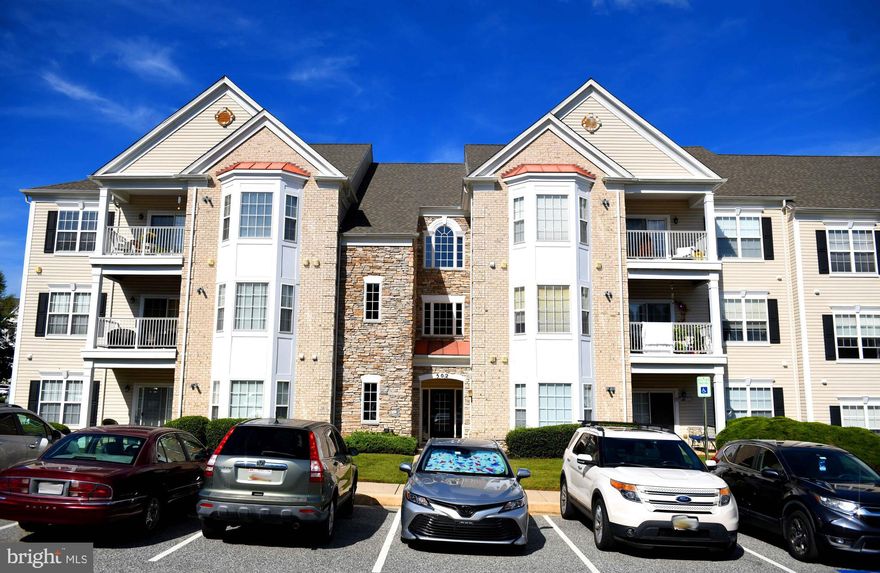 MOTIVATED SELLER!  GENTLY LIVED IN 2 BEDROOM, 2 BATH, SECOND FLOOR, REAR CONDO WITH ELEVATOR. 9' CEILINGS! FOYER AND DINING ROOM WITH CROWN MOLDING, CHAIR RAILING AND WAINSCOTTING. KITCHEN WITH BEAUTIFUL 42" CABINETS, LAZY SUSAN, ALL APPLIANCES, RECESSED LIGHTING AND LAMINATE FLOOR. PRIMARY BEDROOM WITH LARGE BAY WINDOW,  CEILING FAN, TWO CLOSETS, LINEN CLOSET AND DOOR ACCESSING SHOWER BATH. LIVING ROOM WITH SLIDER TO PATIO. BEDROOM TWO WITH DOUBLE WINDOW.  DEN/STUDY WITH WINDOW AND ELECTRIC PANEL BOX.  FULL HALL BATH. HANDICAP ACCESSIBLE, WIDE DOORS, LOWER LIGHT SWITCHES AND ELEVATOR. SMOKING IS NOT ALLOWED INSIDE THE BUILDING, ONLY ON PATIO. PETS ALLOWED, WEIGHT LIMIT 35 POUNDS. LENNOX AIR CONDITIONER INSTALLED 8/25 AND WHIRLPOOL WASHER 8/24. THERE ARE NO SPECIAL ASSESSMENTS SCHEDULED