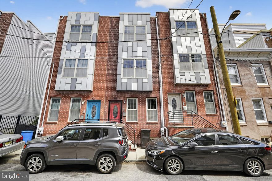 This beautiful 3-story home is situated in the growing area of Wharton, a few blocks from Dickinson Square Park.   Enjoy local hot spots such as Moonshine, Grindcore House, Rebel & Wolf Cafe, 2nd Street Brewhouse, and much more.  Take a stroll up Moyamensing Ave or along the Front Street corridor for access to even more restaurants, grocery stores, retail shopping, and other conveniences.   Easy access to public transportation and I-95.   The home features a traditional red brick facade and an open main level with hardwood flooring.   The modern kitchen offers wood cabinetry, a peninsula island with granite countertops and barstool seating, and stainless steel appliances.   The back patio is a great place to lounge and includes a large storage container.   The second floor offers two comfortably sized bedrooms and modern full bathroom with tub.   The third floor houses a spacious primary suite with plenty of room for a King-size bed and other furnishings.   The en suite primary bathroom features a tiled walk-in shower and large vanity.   Head up to the Roof Deck and take in gorgeous panoramic City views!   Last but not least, the finished basement provides even more flex space that can serve for entertainment, kids play room, office, or anything else that suits your unique lifestyle.   A convenient half bathroom and laundry area complete this level.   419 Mercy Street truly has everything you need for the ultimate City living experience!  It's a home you can grow into and enjoy for many years to come.   Schedule your showing today!