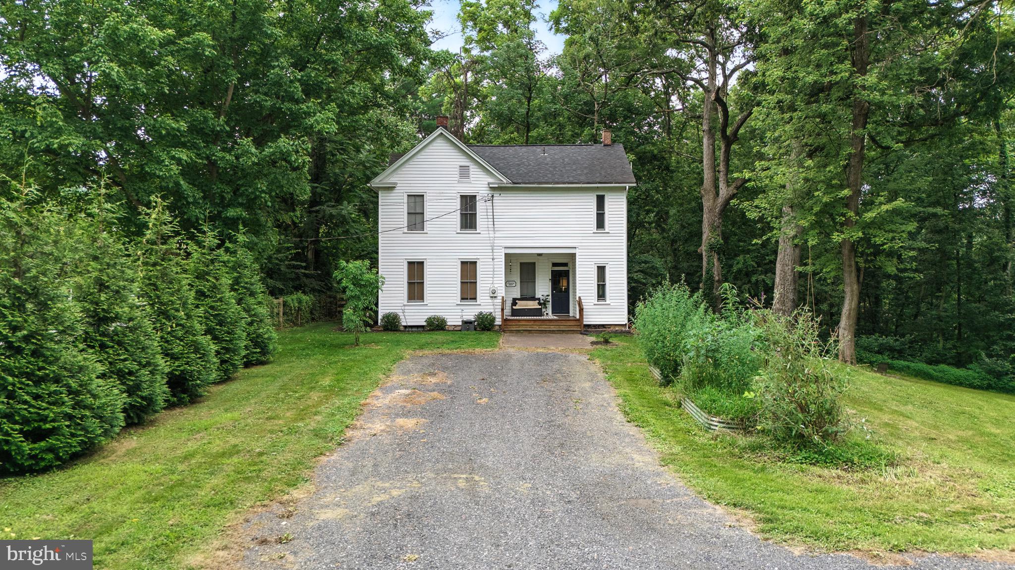 Step back in time with modern comfort at this historic farmhouse in the Honeywood community of Falling Waters! This charming 1920s farmhouse sits on over an acre of peaceful land and features 3 bedrooms, 2 bathrooms, original hardwood floors, a beautifully renovated kitchen, and a cozy screened-in back porch. Recent updates include a new roof. Enjoy access to community amenities including riverfront grounds, a private boat ramp, and a gorgeous in-ground swimming pool. Bursting with character and modern updates, this home is ideal for those seeking timeless charm and a laid-back lifestyle. Just a short drive to commuter routes yet feels a world away!