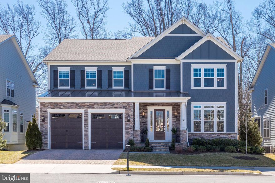 Wonderfully designed and thoughtfully improved single family home in a cul-de-sac community with a private rear deck, screened porch, and rear patio with hot tub all backing to a wooded green space.  The open and light-filled floor plan features hardwood floors, coffered ceiling, custom cabinetry and upgraded designer window treatments and lighting make this home ideal for entertaining and everyday living. The extra wide kitchen island pairs with ivory-white 42” flat-panel maple cabinetry and a gorgeous granite countertop and backsplash in a sophisticated kitchen with deluxe appliance package, and opens up to a breakfast room with bar as well as the screened-in porch. The family and dining room area features walls of windows and gas fireplace with natural slate hearth and surround. On the upper level, a large primary suite features a private sitting area, two  walk-in closets with custom cabinetry, and en-suite bathroom with a deluxe soaking tub and spa shower with dual heads. Three spacious secondary bedrooms , all with ensuite bathrooms. The fully finished walk-out lower level has a large recreation room with a rough-in for a wet bar,  a media room,  and an extra bedroom with access to a full bath. The lower outside patio has been upgraded with stone pavers, waterproof underdeck ceiling system, LED lights and fans. The house has also been upgraded with Nest Thermostats and Security cameras, a 5 zone lawn sprinkler system, and upgraded flooring and storage cabinets/racks in the garage. This stunning home is located in a small cul-de sac community in Falls Church that feeds Mclean schools, and is just minutes away from downtown Arlington, Mclean, Falls Church and the metro. HOA fees are $95/month, and they cover  trash and snow removal. This is a must see home and is sure to impress!