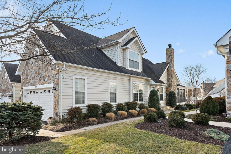 Stunning and rarely available Granview Model Carriage Home with First Floor Primary Bedroom in desirable Belmont Country Club. Many upgrades throughout include Hardwood Floors, Custom Moldings, Cherry Cabinets, Granite Countertops, and Upgraded Ceramic Tile, just to name a few. The primary suite features vaulted ceilings, walk-in closets, and a sitting area. The upper level features a versatile and large loft with two additional spacious bedrooms and a shared full bath. Finished lower level with large recreation room, third full bathroom, plenty of unfinished storage area, and wet bar. Screened-in porch, large deck, with Pergola, and access to lower paver patio. Backyard opens to common area and plenty of guest parking.