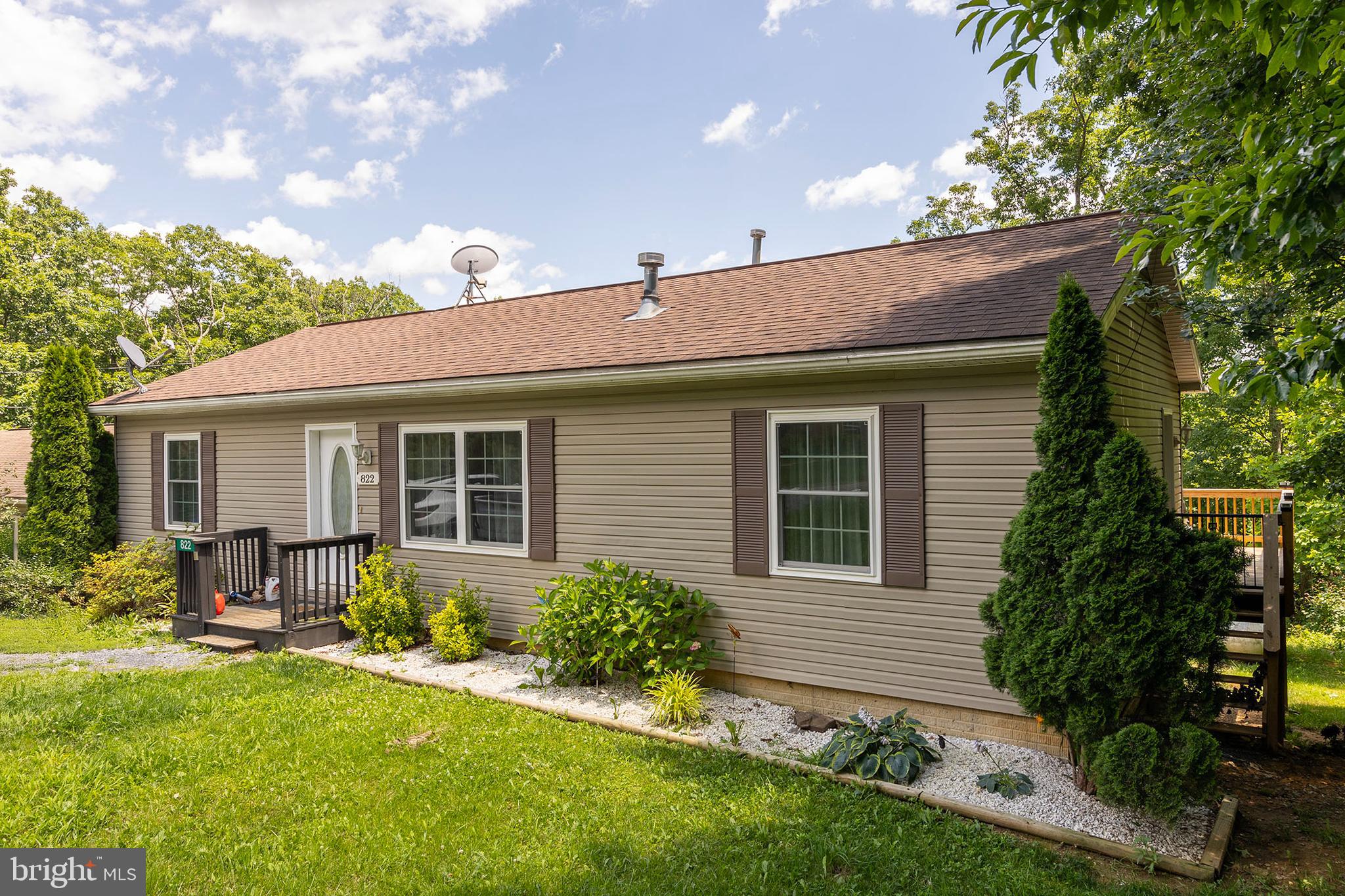 PRICE IMPROVEMENT! Welcome to this charming ranch home with spacious backyard and unfinished basement. Set on a generous lot in Mountain Falls, this property has 3 bedroom and 2 bathrooms. Functional kitchen with ample cabinet space and adjoining dining room. Comfortable main-level layout-ideal for easy everyday living. Unfinished basement with walk out access. Back deck great for gatherings. Don't miss this opportunity to own this home and make it your own.