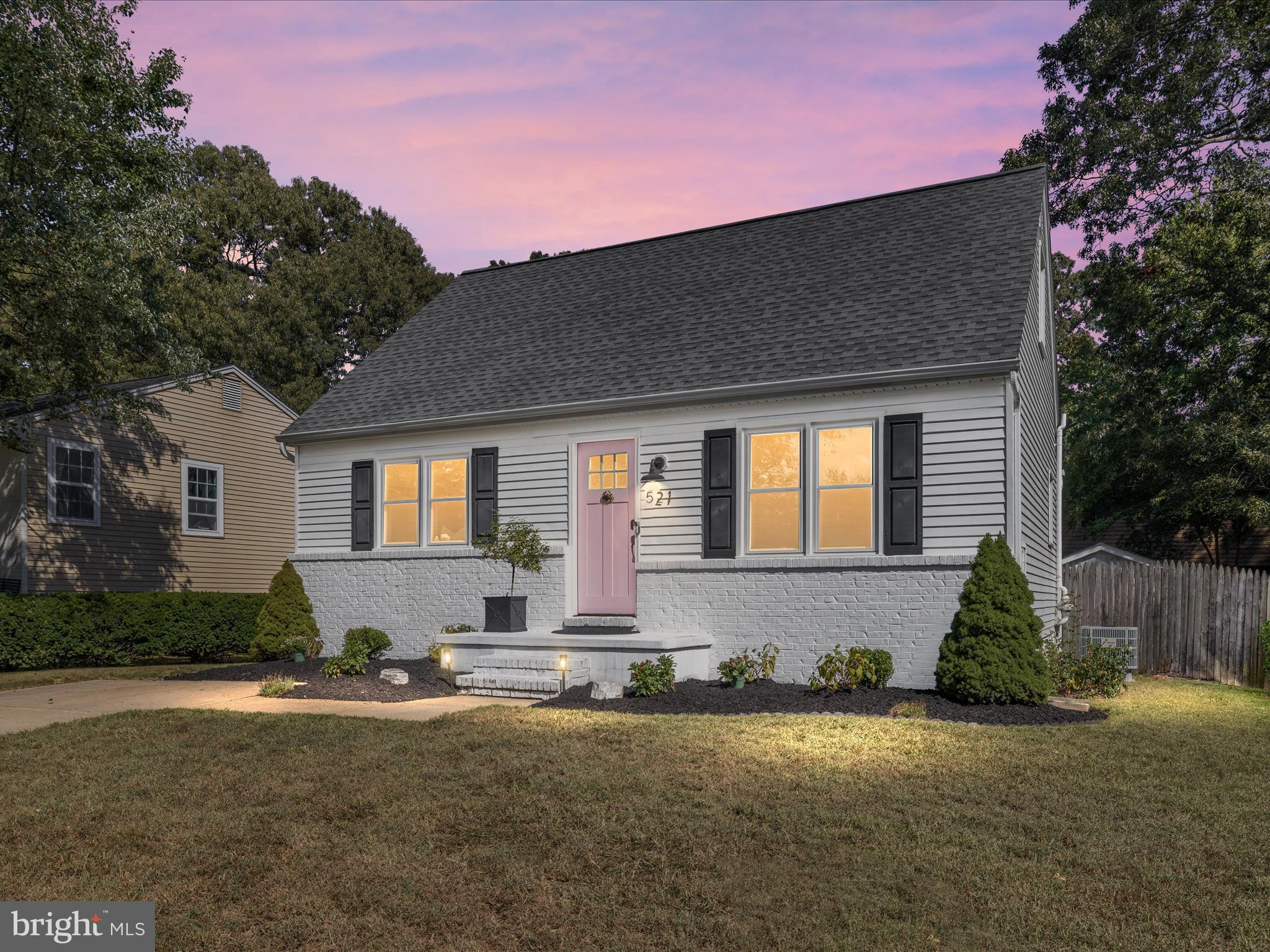 Here it is: the charming, totally renovated coastal-style home you've been looking for! Welcome to this beautiful Cape Cod located in Severna Park's water-privileged community of Carrollton Manor. Situated on a quiet street just blocks from the Severn River, this 3-bedroom home features thoughtfully curated upgrades and inviting indoor and outdoor living spaces.
The main level offers newly installed LVP flooring, a sunlit living room, and an expanded and renovated kitchen with custom cabinetry, quartz countertops, top-of-the-line KitchenAid appliances, an oversized island with built-in shelving, and corner bench seating with under-storage. Upgrade your mornings with the built-in coffee bar! From the kitchen, step out onto the spacious rear deck overlooking the fenced backyard—ideal for entertaining and play.
The main floor renovation also includes a luxurious primary suite. A peaceful, spacious bedroom leads to a large, thoughtfully designed walk-in closet with plenty of storage. The new primary bath includes a free-standing soaking tub, tiled shower with glass surround and rain shower head, and charming quartz-topped vanity. You'll love the expanse of marble tile under your feet and soothing coastal colors to start and end your days!
Two charming upper-level bedrooms share a central half bath. These functional spaces would also make a great office space, music room or craft area.
The lower level features a cozy family room with a built-in bar, shiplap detailing, a mini-fridge, and a laundry area tucked behind barn doors. An expansive storage area includes built in shelving. The basement was enhanced in 2025 with new carpeting and baseboards and a new exterior door. A rear walkout leads to the fully fenced backyard with a fire pit and shed. Whether you're playing lawn games or inviting friends for a crab feast on the back deck, the beautiful backyard is a private and peaceful green space.
The current owner has made substantial improvements in 2024-25, including a full primary suite renovation, new Bosch HVAC system, new KitchenAid electric convection range, dishwasher, refrigerator and microwave (with convection oven and air fryer) larger electric water heater, new carpet (upper and lower levels), wood flooring on the main level, and full ductwork cleaning and sanitization. Cosmetic updates include fresh interior paint, new outlets, outlet covers, sockets, and vent covers, and professional landscaping featuring new trees, shrubs, and updated fencing.
Other major system updates include a newer roof (2021) with a transferrable 10-year warranty and premium replacement windows (2021).
Carrollton Manor residents enjoy access to three Severn River waterfront areas offering beaches, a fishing pier, boat ramp, slips (waitlist), and a community clubhouse. While the property does not have a formal HOA, the neighborhood is governed by the Carrollton Manor Improvement Association, a special community benefit district (SCBD), with an annual assessment of $150. You'll love living within walking distance of shops, restaurants, a grocery store, and services, including salons and banking!
Conveniently located near Route 2 and major highways, this move-in-ready home provides quick access to Annapolis, Baltimore, and Washington, D.C. Don't miss your opportunity to own a turnkey home in one of Severna Park's premier water-access communities.