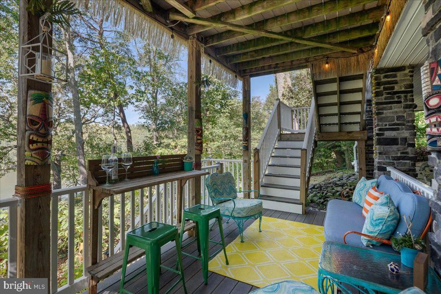 TURN-KEY ON MILL CREEK, DRUM POINT! This beautiful move-in ready home is being sold furnished, and offers the perfect blend of comfort, style, and waterfront living. The elevation assures no flood plain, the hardwoods are gorgeous in the autumn months, shady in the summer. The home is ideal as a full-time residence, a vacation retreat, or an income-producing Airbnb. (The Sellers have records of 18 months of part-time STR). The lot offers extra parking, access from the driveway level to a great roll-up garage door with a walk-through to the creek side of the house. Generally speaking, the architecture and low maintenance features are sensitive to the waterfront lifestyle: the synthetic slate roofing is known to be long-lasting, the vinyl exterior is known to be low maintenance, rock scape instead of plantings underneath. The multiple levels are worked into the slope of the site, and the design provides access points that make sense: the storage are with garage door is closer to the creek than to the street, the levels of decking are easily accessible from the street side or the creek side, etc. Water enthusiasts will love the private pier–ready for your boat, kayaks, or jet skis!! Water depth of 6 ft+ means that deep-keel sailboats will be happy here in the multiple slip options, and the high elevation sides of Mill Creek with old growth trees offers protection from storms. Included in the sale is a floating pier platform…perfect for kayak and SUP launch, additional play area! The home’s entrance is via vestibule, and gives that perfect arrival effect. The kitchen-dining-living-deck space plan for this main level makes a perfect flow for entertaining as well as everyday enjoyment of the home. Pops of color throughout the house make for a cheerful space! Bonus: a generously sized bedroom and a full bath on the main level. The large primary suite on the upper level is a real retreat…it has Mill Creek views, a large sitting area, and a private bath with shower and custom vanity. Bedrooms 3 and 4 are also on the upper level, with a shared bath. A very special chat-n-chill spot is the lower level tiki bar!! Grab a drink and head to the pier or go wildly into the night with your mai tai! Whether you’re fishing, crabbing, or simply enjoying the peaceful surroundings, this property has it all. Don’t miss your chance to make your waterfront dreams a reality!!