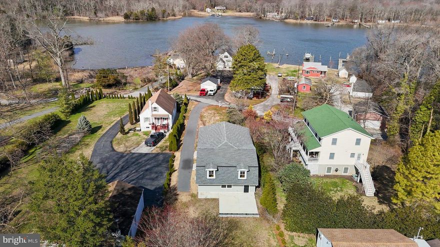 ***AGGRESSIVE PRICE REDUCTION***Welcome to beautiful 2507 Island View Road. Discover the pinnacle of coastal-inspired living in this stunning, custom-built Modern Farmhouse. This incredible home features 4 spacious bedrooms and 3 full bathrooms, located in the exclusive water-oriented community of Barrison Point.  Expertly crafted with unparalleled attention to detail, this light-filled sanctuary features an open-concept layout anchored by a gourmet kitchen with custom cabinetry, quartz countertops, and an oversized entertainer's island. High-end finishes abound, including gleaming hardwoods, Pella windows and sliding door, and solid core maple and cherry interior doors. Rock Wool insulation and high-efficiency split HVAC units in every room ensure maximum comfort and energy efficiency.  The versatile floor plan boasts those four bedrooms, including two private en-suites, and a separate entrance perfect for an in-law suite, au pair quarters, or a secluded home office.  Situated on a private .23-acre lot just steps from the water, you are walking distance to Rocky Point State Park, public boat ramps, and local golf courses. Experience a rare sense of tranquility in this private retreat, where the stillness of your secluded surroundings is perfectly balanced by easy access to nearby marinas, hiking trails, and local waterfront favorites.