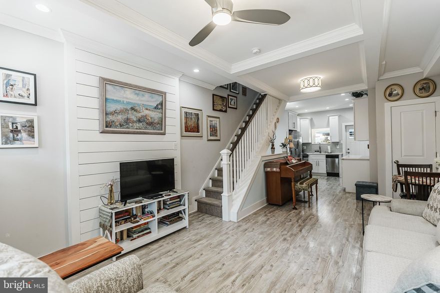 Motivated Seller! Welcome to 2504 S American St, a designer-like 2 story, 2 bedroom, 2 bath, porch-front home that could easily grace the pages of Architectural Digest. This pristine and perfect residence offers an open floor plan, abundant natural light, a beautiful kitchen, expansive outdoor space, two generously sized bedrooms, two full spa baths, and a finished lower level. Upon arrival, a private porch invites you into the main level, where you'll discover a stunning living room and dining room adorned with wide-plank floors, coffered ceilings, a shadow box, and shiplap walls. A large window floods the space with light, creating a warm and inviting atmosphere. The living and dining area seamlessly transitions into a tastefully designed kitchen featuring 42-inch cabinets for ample storage, designer quartz countertops with a ceramic tile backsplash, Frigidaire stainless steel appliances, and a separate island with a built-in wine refrigerator. From the kitchen, a rear door opens to your own canopy-covered garden oasis, the perfect setting for dining al fresco. A beautifully restored staircase leads to the second level, where you'll find a sun-drenched, expansive master suite with double-wide windows, wide plank flooring, a designer ceiling fan, a gorgeous raised-wood paneled wall, two closets for ample storage, and a luxurious full marble bath with a double vanity and frameless glass shower. Additionally, the rear bedroom features a large window and closet, while the hall area boasts another tastefully done spa bath and a convenient front-loading washer and dryer nook. The fabulous, finished basement offers generous ceiling height, mechanicals, and two separate extra storage rooms. This space provides flexibility for various uses, enhancing the home's functionality. This home is not your average two-story, two-bedroom dwelling. With meticulous attention to detail and friendly neighbors in a convenient location, 2504 S American St could be the perfect fit for you.