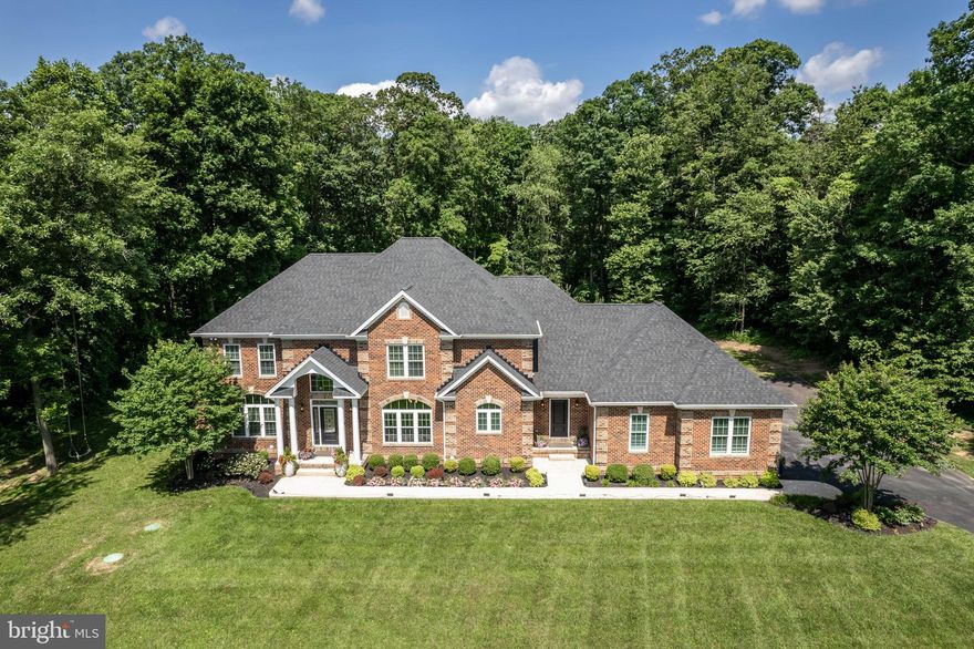 This magnificent residence epitomizes luxury living with its impeccable
design, unparalleled quality, and serene surroundings. Step inside to discover an oasis
of elegance, from the grand two-story family room to the chef's kitchen designed for
culinary excellence. The main level master suite offers a sanctuary of comfort, while
three additional bedrooms provide lavish accommodation for guests. Delight in the
seamless flow from indoors to outdoors, where a new stone patio beckons for alfresco
dining amidst lush landscaping. An expansive unfinished basement awaits your
personal touch, this home is the epitome of refined living. Don't miss the chance to
experience the pinnacle of sophistication in this extraordinary colonial estate.