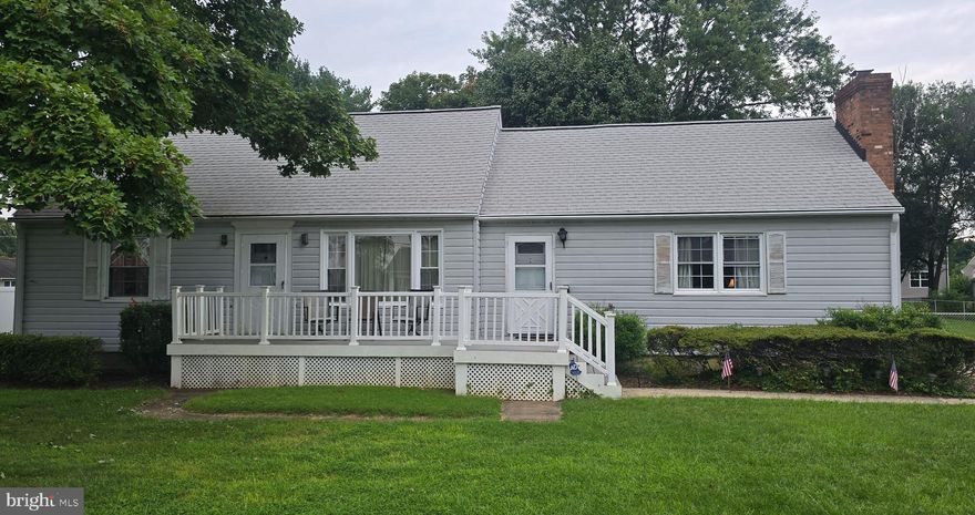 BACK ON THE MARKET WITH NEW FLOORING!!!!  All carpeting has been replaced with vinyl plank flooring.  NO HOA!!  NO HOA!!  NO HOA!  This unique three bedroom extended rancher with 1,744 square feet of living space (according to county records)  is a must see!  The main portion of this home was constructed in 1957 while the larger multipurpose room including a gas fireplace, half bath, mud and laundry room is located in the addition which was constructed in 1973.  The ceiling in this large great room is nicely painted in a decorative pattern. Stained wood trim and some paneling adorns the room.  This room has one of the two front entries and two back entries.  The three  bedrooms are located in the original section of the home with all rooms located on the first level with the exception of a very spacious third bedroom in the attic.  The living room provides a view to the street through a large picture window and the two main level bedrooms are located to the left of the living room with the full bath separating them.   The kitchen is an eat-in-kitchen with ZBrick covering two walls.  The kitchen can use a little TLC, but has great potential. The kitchen opens up to the large great room in the newer portion of the home.  The home has vinyl siding, two front entrances accessed via a Trex deck/porch with PVC trim and railing.  The back porch, with a cement base is covered.  The back and front porches are connected via a cement sidewalk.  The paved driveway is a double driveway with the capacity to park up to six cars.  The backyard is flat and large allowing for many opportunities for entertaining., not limited to, but could host an additional shed/work area, swimming pool, fire pit, any many more recreational opportunities.  This property consists of two lots that are being sold together (37B4C22 and 37B4C23) which is why the backyard is more spacious than most.  Two sheds are located to the back left of the yard with one equipped with electricity.  The backyard is enclosed with a chain link fence. The roof was replaced in 2018.  The gas furnace is located in the crawl space and central air conditioning is provided throughout the home.  The furnace was replaced in October 2022.  . Come see this home that is located within miles of shopping, recreation, and easy access to the VRE.