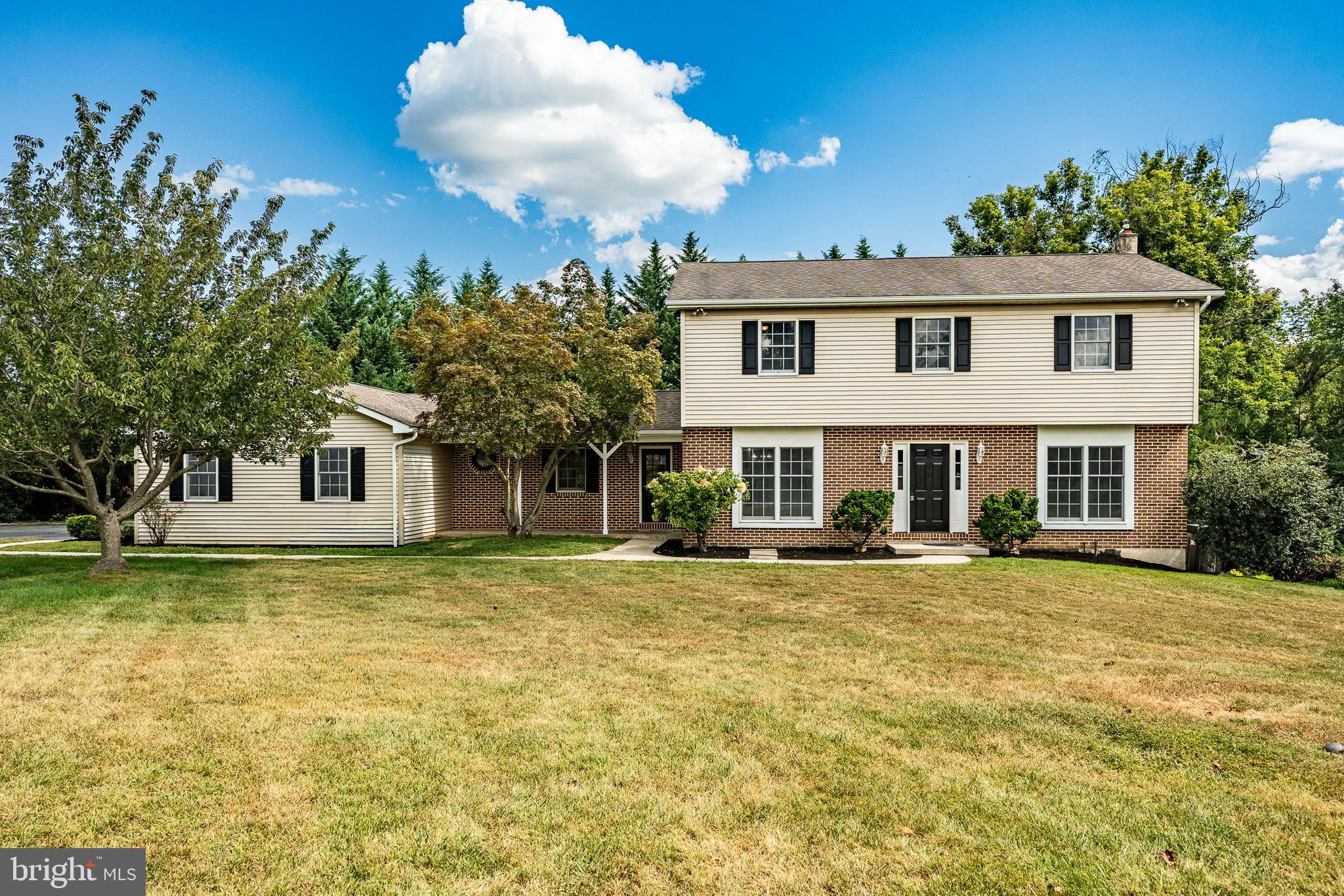 New, New, NEW!! Welcome to 16 Long Drive, a beautifully updated home in the rolling hills of East Caln Township & the highly sought after Downingtown School District! Set on nearly an acre in a cul-de-sac with a charming brick façade, mature landscaping, and a three-car garage. Step inside the spacious foyer and immediately notice the bright, neutral color scheme, new flooring, lighting fixtures, and hardware throughout. The large front living room is filled with natural sunlight and flows seamlessly into the Kitchen—perfect for entertaining. The heart of the home is the stunning eat-in kitchen featuring a large center island, white cabinetry, quartz countertops, tile backsplash, farmhouse sink, and brand-new stainless steel appliances. A breakfast area with a modern light fixture and sliding glass doors opens to a screened-in porch, ideal for enjoying the outdoors in every season. A second large living room off the kitchen provides flexibility for gatherings, while a first-floor laundry room and powder room add convenience. Upstairs, the private primary suite offers a true retreat with a huge walk-in closet and a spa-like bathroom showcasing a double vanity, arched mirrors, tile flooring, and a tiled shower with decorative niche. Three additional spacious bedrooms with new carpeting, ample closets, ceiling fans with lighting, and abundant natural light complete the second floor. Walk out finished basement is ready for your finishing touches! The screened-in porch with wood accents and decorative flooring extends to a large deck and wraparound sidewalk leading to the 3-car garage. With .85 acres of property, you’ll enjoy both space and privacy while still being close to everything East Caln has to offer. Home owned by licensed PA Realtor