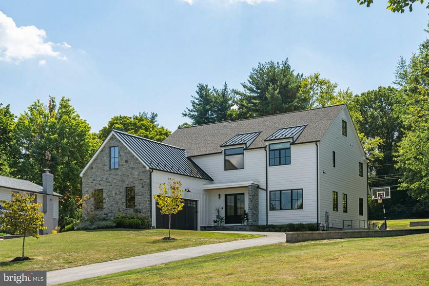 Just 2 years young, 428 Fawn Hill Lane is a showstopping custom home located on over an acre of land in a highly coveted neighborhood of Lower Merion Township.  It is apparent that every detail was considered when this home was designed and constructed - the modern craftsman style, the well thought out floor plan, and all of the designer finishes - nothing more is needed than to just move right in.  Upon entering the home through the double front doors into the 2-story foyer, you are greeted with a bright, open, and functional layout accompanied by a stunning exterior view.  You’ll immediately notice the wide plank white oak flooring, sophisticated light fixtures, and 10’ ceilings that continue throughout the first floor.  Just beyond the foyer, the private home office is an ideal place to spend your working days in front of the large picture window.  Continuing on the first floor, the expansive family room contains a gas fireplace that has been clay-glazed for a sleek concrete look from floor to ceiling.  The open and airy dining room with access to the back patio is fit to host all of your guests for holidays and parties alike.  The magazine-worthy extended kitchen is a chef and entertainer’s dream with its oversized island and custom Adelphi cabinetry, GE Monogram appliances, 48” range, beverage refrigerator, custom range hood, quartzite countertops, elegant Bedrosian Cloe tile backsplash, and open shelving.  The adjacent pantry space contains a second sink, dishwasher, and additional cabinetry and open shelving - just close the pocket door and the kitchen mess is hidden! Just off the kitchen is a breakfast area and sunroom with 2 walls of windows and doors currently being used as a playroom.  And to complete the first floor, the mudroom off of the attached 2 car garage (which includes a smart garage door) has whitewashed brick herringbone flooring, custom built-in “cubbies”, powder room, and access to the basement.  The second floor contains 4 large and sunny bedrooms (2 of which also have an en suite bathroom), hall bathroom, laundry room, linen closet, and reading nook. The master suite is not to be missed with its double doors, balcony overlooking the rear yard, beamed ceiling, coffee bar with beverage refrigerator, and walk-in custom closet.  The luxury bathroom contains a curbless tile shower, double vanity, loads of storage, dreamy soaking tub, separate toilet room, and radiant heated floors.  The 2,000+ square foot basement is ready to be finished and has 9’ ceilings, walk up stairs to the backyard, a 3-piece plumbing rough in for a future full bathroom, and a French drain around the perimeter.  Outside, a covered front porch, a gracious bluestone patio with built-in gas fire pit, and an expansive yard with custom landscaping added for privacy complete this storybook setting.  The home had previously been approved for a pool and cabana house should the lucky new owner choose to add this.  Other upgrades include Control 4 Smart Home security system, upgraded speaker system in the first floor, primary bedroom, and back patio, smart blinds in office and primary bedroom with first floor wired for future smart blinds, and a whole-house generator.  The location can not be beat with quick access to I-76 and 476, Suburban Square, and Whole Foods, all within the award-winning Lower Merion School District.  Get the benefit of a fabulous new construction home without having to wait for the construction to happen.