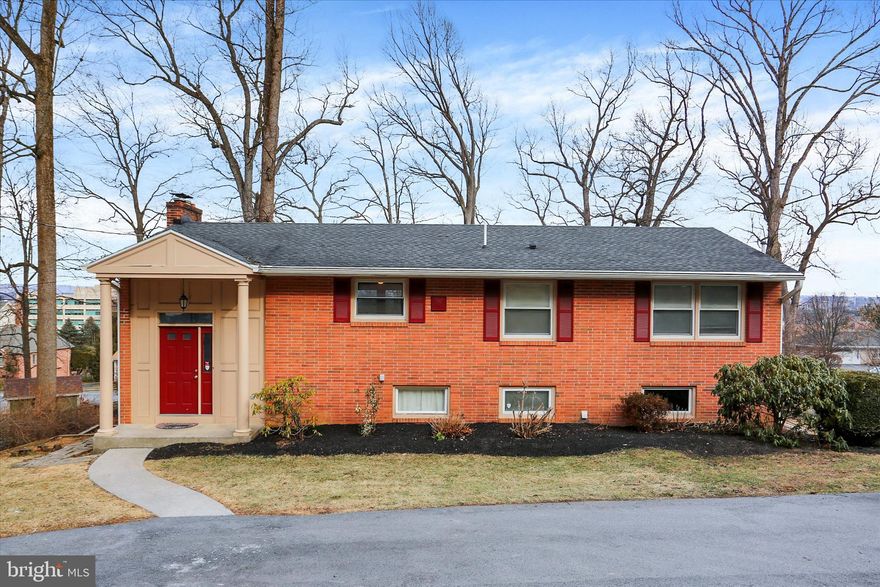 This premium, incredibly attractive location in Derry Township home is nestled in the South Hills of Hershey on a .42-acre lot next to the Hershey Medical Center. The home is so close to the Hershey Medical Center you can walk there for work! Like a cul-de-sac there is very low traffic where you can feel the privacy, peace and quiet, all while being a few minutes from Derry Township schools, athletic fields, the Hershey recreation center, downtown Hershey including shops and restaurants, and of course all the Sweet Hershey attractions! This cozy, solid brick, well-maintained home includes approximately 2,100 sq. ft. of finished living area including 4 Bedrooms and 2 Full baths. The home features refinished Hardwood floors (3/2026) throughout the main level and the interior painted (3/2026) and crown molding on the main floor. A combination living room and dining area includes a cozy wood burning fireplace and hardwood floors. Next to the family room & dining area, there are three sets of sliding doors that provide ample light and 3 ways to access the huge (32 X 12) composite base deck where you can enjoy gorgeous views of Hershey and Hersheypark fireworks and is ideal for entertaining family and friends. The kitchen features an island and stainless-steel appliances. The lower level includes a 4th bedroom or office, a full bathroom and a family/Multipurpose room is exposed with 5 windows and 2 doors to walk out into the fenced in yard area. The driveway was replaced (2024), deck base upgraded with composite decking (2023), Heat pump/Central A/C installed (2020). Active radon system. Interior pictures to be downloaded 3/13/26. A one-year home warranty included for peace of mind. Enjoy all that the “Sweetest Place on Earth” has to offer!