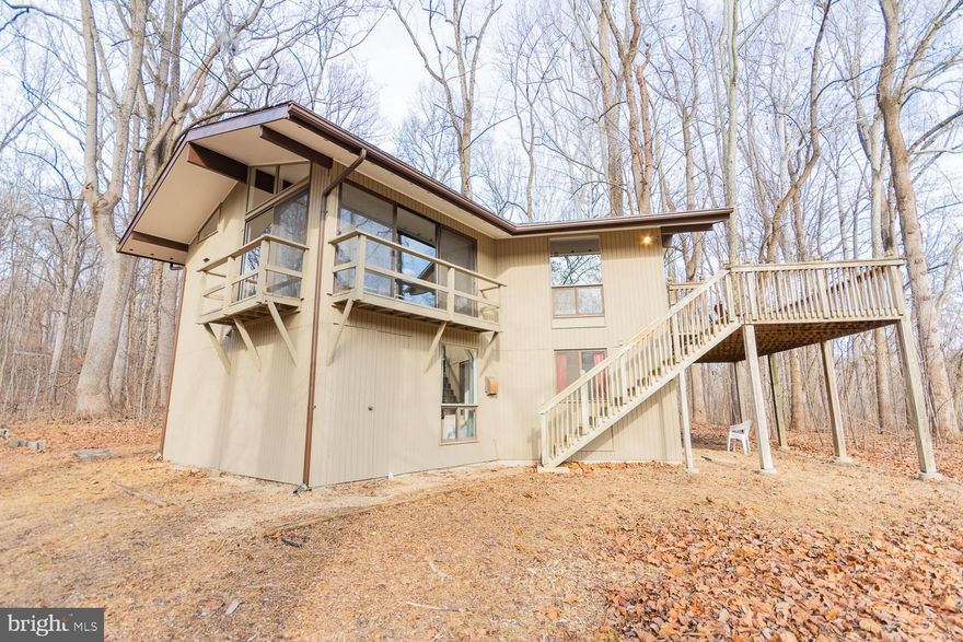 HIGHEST AND BEST OFFERS ARE DUE BY 5:00PM ON DECEMBER 13TH. 3 Bedroom, 2 Bath Chalet on 3.5 Acres in Steamboat Run Community. This stunning property  is furnished and features a curved staircase, free standing wood burning fireplace, all kitchen appliances and washer/dryer.  The wooded setting, offers privacy and tranquility. A highlight of the property is the private stairs that lead down to the picturesque Potomac river, providing the perfect opportunity for fishing, kayaking, and enjoying the natural beauty of the area. Whether you're seeking a peaceful retreat or an outdoor enthusiast's paradise, this property offers the best of both worlds. Don't miss the chance to own a piece of this idyllic waterfront paradise.