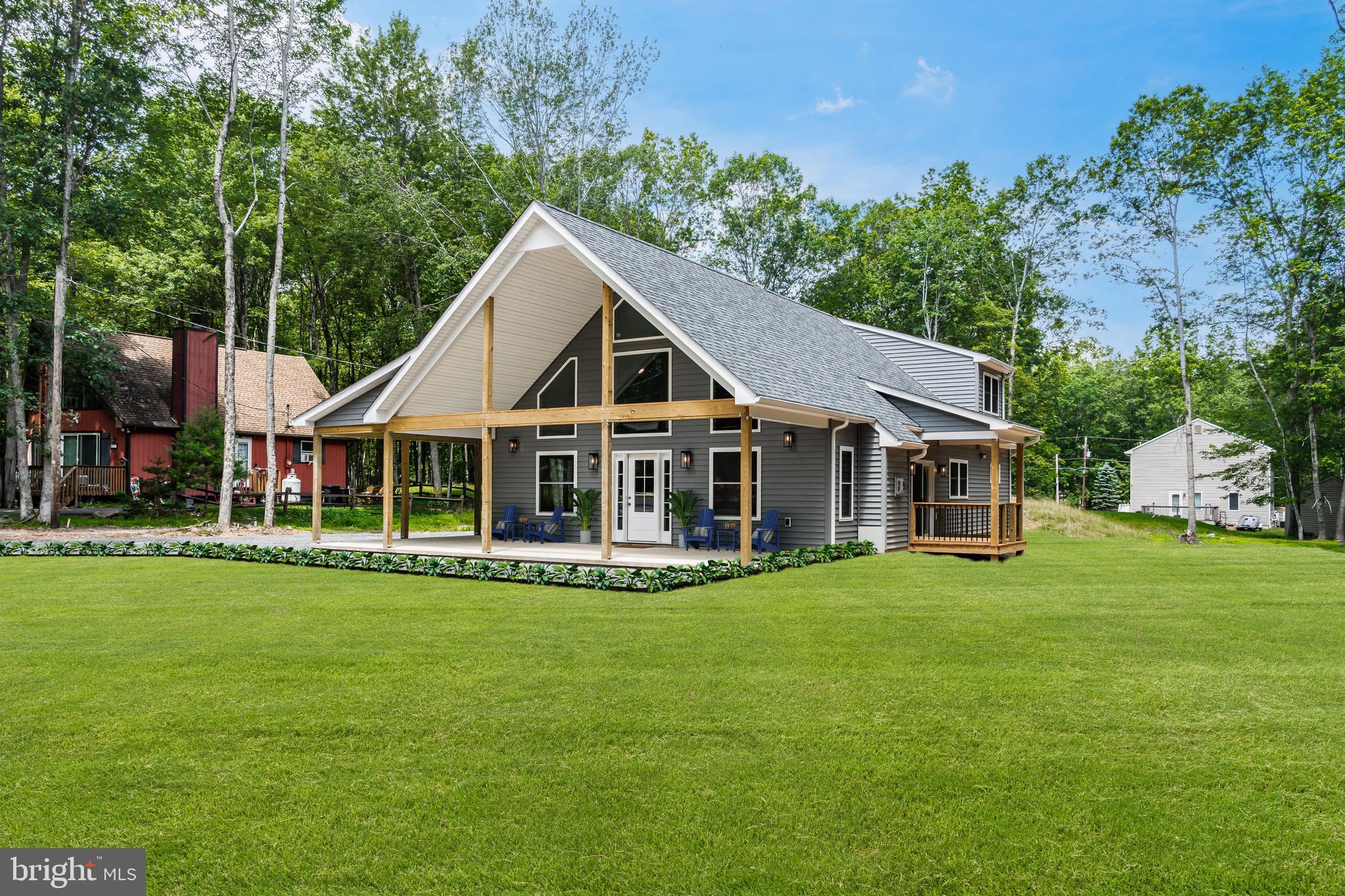 BRAND NEW CONSTRUCTION Tucked away on a quiet cul-de-sac on nearly 1/2 an acre in Towamensing Trails, this newly constructed chalet-style home offers a thoughtful layout and flexible living space in Penn Forest Township. This 3 bedroom, 2 full bath home includes 2,400 sq ft with vaulted ceilings, stunning clerestory windows, and modern finishes throughout. The main living area features luxury vinyl wide plank floors, stacked-stone propane gas fireplace with stone hearth, 72-inch remote-controlled ceiling fan, and an abundance of natural light. Kitchen features include granite countertops, matching stainless steel Whirlpool appliances, soft-close cabinets and drawers, center island with seating for 3, shaker style cabinets and a spacious dining area with slider door that leads to the covered deck. The 2 main floor bedrooms each have double closets, remote-controlled ceiling fans, and individual LG mini-split units. Upstairs, the loft area creates a versatile second family room or lounge area that overlooks the main living area with plenty of natural light. The primary suite offers a spacious walk-in closet and a private en suite bath with double vanity, full tub and shower, and quality inset cabinetry. Towamensing Trails offers their homeowners countless private amenities and is a unique way to experience the best the Poconos have to offer like skiing, festivals, waterparks, shopping and so much more. Schedule today!