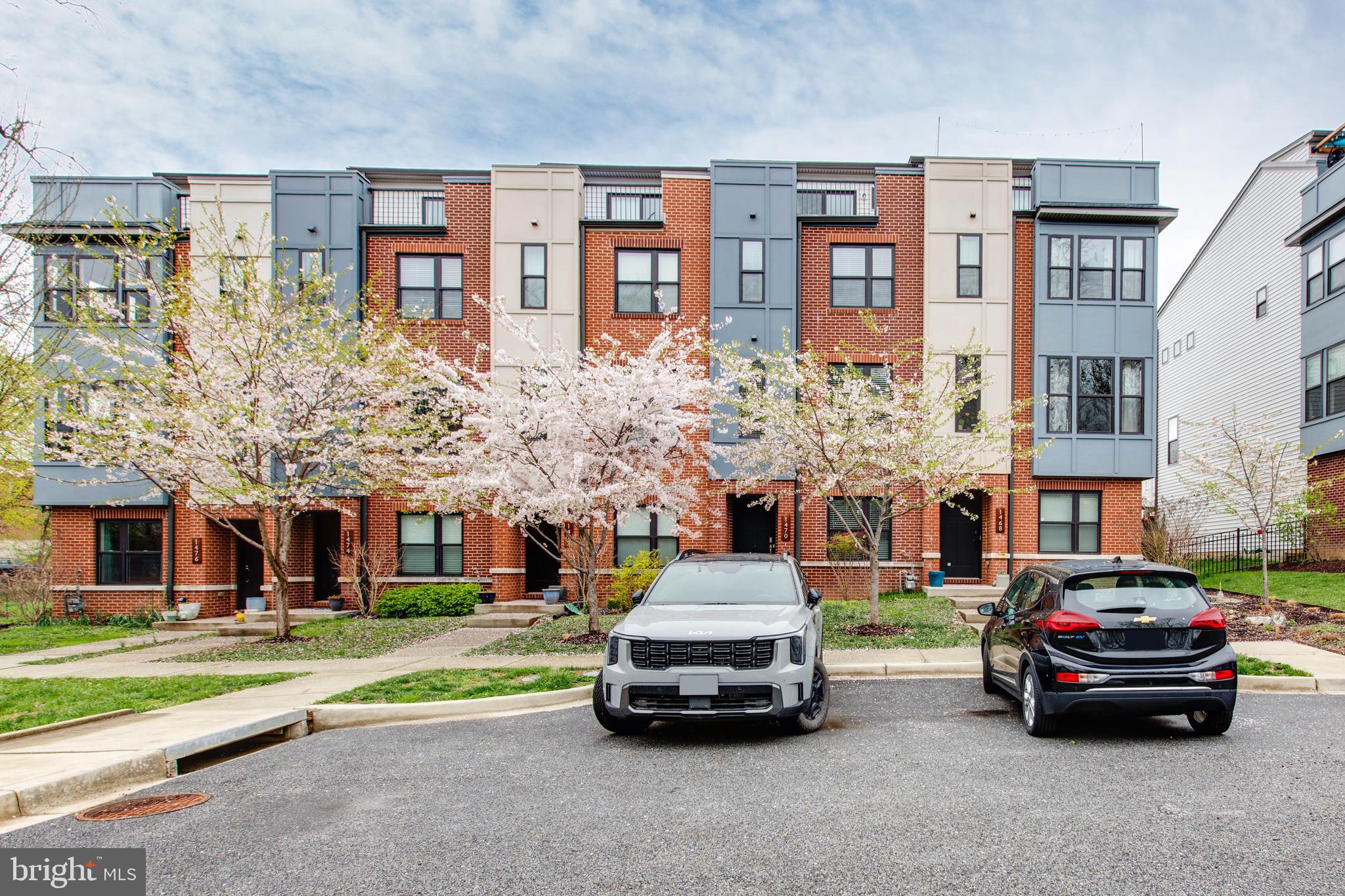 Welcome to 1470 Redfern Ave! This stunning brick-front 4-level townhome with a one-car garage is nestled in the highly sought-after Hampden community, offering the perfect blend of city convenience and modern living. Featuring 4 bedrooms and 3.5 baths, this home is filled with natural light from the moment you walk in. The entry-level offers a private bedroom and full bath—ideal for guests or a home office—with convenient access to the garage. The main level boasts an open floor plan with high ceilings, beautiful hardwood flooring, and a gourmet kitchen complete with a large island, stainless steel appliances, and ample cabinetry for storage. The third-floor primary suite is a true retreat, featuring a spacious walk-in closet and a spa-like bath with dual vanities and a glass-enclosed shower. Two additional bedrooms, a full bath, and a laundry room complete this level. Step outside to enjoy multiple decks, including a rooftop terrace with a wet bar—the perfect space for entertaining or relaxing while taking in the views of lush trees and greenery. Located in a vibrant community with top-rated schools nearby, this home combines luxury, comfort, and location—all in one.