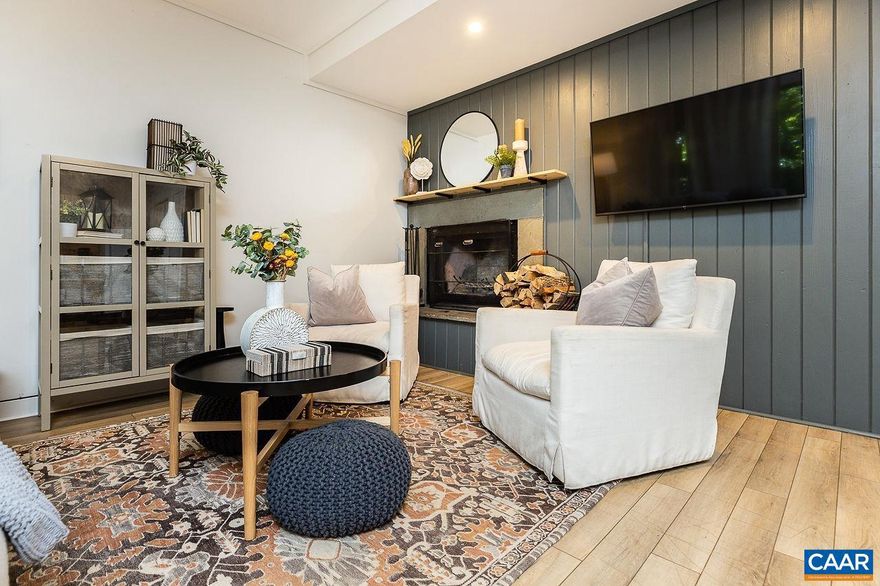 Beautiful 2 bedroom 2 bathroom villa near the ski slopes and centrally located in the heart of the mountain village.  Easily walk to the slopes, entertainment facilities, dining & shopping facilities, coffee shops, etc.  Property is conveniently located on the first floor, and also boasts and end unit position for great privacy.  Extensively renovated, the property has a light and sophisticated feel and is tastefully furnished.  Full HVAC.  2 exterior ski closets, offering plenty of room to store all your sporting gear.  Authentic woodburning fireplace, with firewood provided by the condo association.  And the Three Ridges Condo Association offers the lowest condo dues at Wintergreen at only $867.00 per quarter.  Property is turnkey, furnished, and ready to be enjoyed by your or your guests!,Fireplace in Living Room