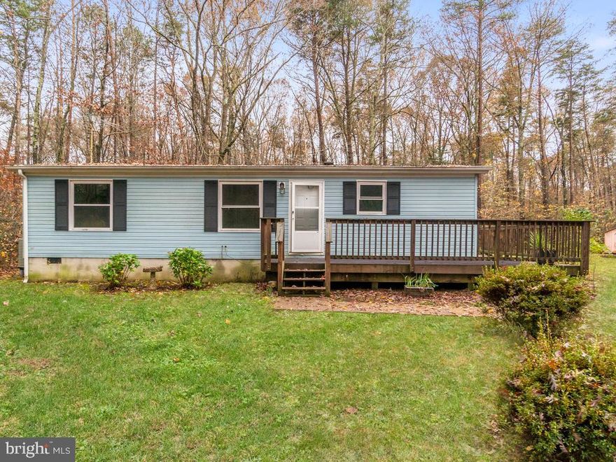 Cute, Very affordable double wide on 3 acres, wooded lot, 3 bedrooms, 2 full baths, very well maintained home with a wrap around deck. Plenty of privacy in a well maintained neighborhood. Just minutes from Lake Anna and the town of Fredericksburg.  HVAC is 4 years old.  Being sold AS IS.  Only Cash or Conventional  financing contracts will be considered