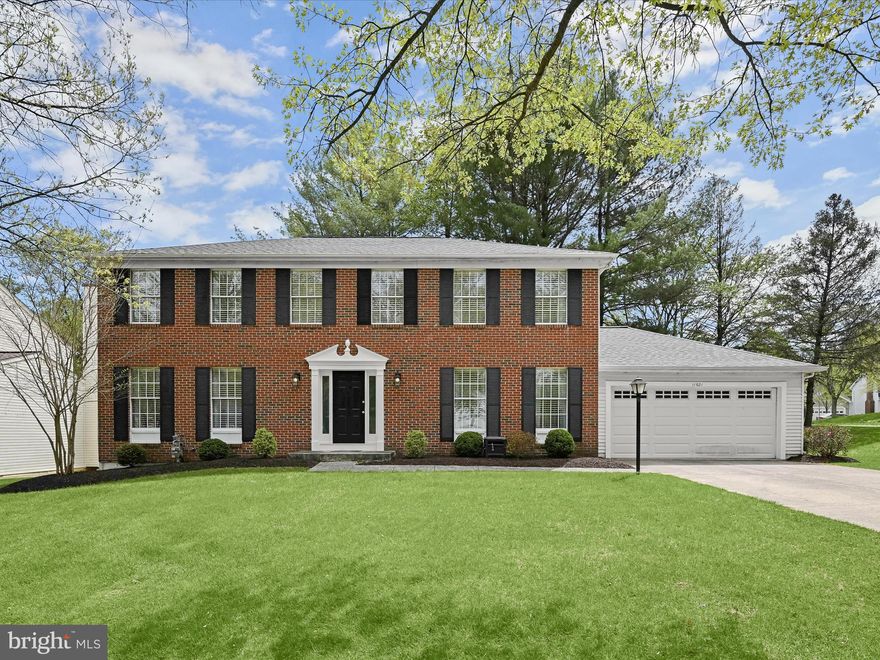 Beautiful brick-front colonial tucked away on a quiet cul-de-sac in one of Columbia’s most sought-after communities! This spacious home features thoughtful updates throughout, including a remodeled kitchen and bathrooms, and offers an ideal blend of comfort, style, and functionality.  The main level showcases rich wood flooring, accent molding, and recessed lighting, with formal living and dining rooms, and a cozy family room that opens to an expansive deck—perfect for indoor-outdoor living. The remodeled gourmet kitchen is a chef’s dream, boasting an oversized island breakfast bar with pendant lighting, granite countertops, tile backsplash, and stainless steel appliances including dual wall ovens.   Upstairs, the primary suite impresses with a walk-in closet and a luxurious spa-inspired bathroom featuring a dual granite vanity, a soaking tub, and an oversized frameless glass shower. A second bedroom adjoins the primary suite, offering flexible use as a nursery, office, or private sitting room. Three additional bedrooms and a full hall bath complete the upper level.  The finished lower level provides a spacious recreation room and a large storage area with a bath rough-in—ready to customize to suit your needs.  Enjoy outdoor living on the expansive deck with built-in seating, and take advantage of the prime location near major commuter routes, as well as abundant shopping, dining, and entertainment options.