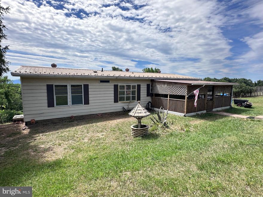 KEYSER , WV - 5 BDRM, 2 BATH RAISED RANCH-STYLE HOME ON 2+ UNRESTRICTED COUNTRY ACRES. LARGE LIVING ROOM WITH ONE OF A KIND FIELD-STONE STACKED FIREPLACE W/ MANTLE SHELVES AND WOOD BIN. SEPARATE DINING AREA. BREAKFAST BAR (CENTER PEICE) ISLAND AND UPGRADE STAINLESS STEEL APPLIANCES IN EAT-IN KITCHEN. MAIN FLOOR MASTER BEDROOM W/ PRIVATE GARDEN TUB MASTER BATH. REAR ADDITION OVERLOOKS PRIVATE REAR YARD.  FULL BASEMENT W/ 3 ADDITIONAL BEDROOMS, REC ROOM AND UTILITY W/ 36" DOOR FOR EXTRA OUTDOOR STORAGE. (7X10) SHED. PAVED IN/OUT DRIVEWAY. HUGE COVERED FRONT PORCH. ABSENTEE OWNER DESIRES QUICK SALE!