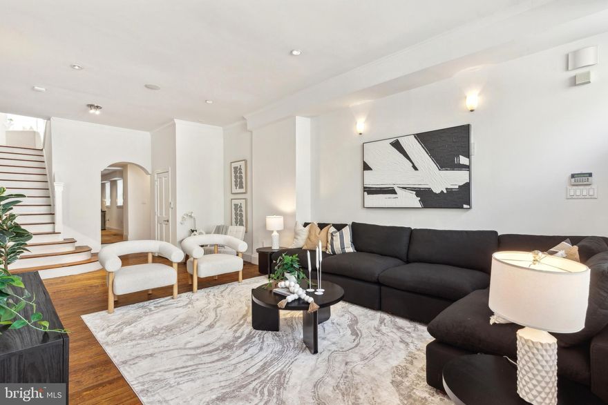 Incredible opportunity to own a historic home, designed for entertaining! Located on a prime block in Washington Square West, this former store front was converted and fully restored in 2003. Currently configured as a 2 bedroom + den home, this property features high ceilings, wide-plank hardwood floors, crown molding, preserved fireplaces, recessed lighting, and more. The 1st floor living room is graciously proportioned, and leads to the formal dining area and open kitchen featuring custom-built wood cabinetry, stainless steel appliances, and good counter space. Stairs to the 2nd floor lead to the open den/sitting area with skylight, that could easily be converted into a 3rd bedroom. The 2nd floor primary suite is spacious with good closet space, and an ensuite custom tiled bathroom with roman-style sunken bath and shower. The light-filled 3rd floor bedroom suite showcases a vaulted ceiling, mosaic-tiled full bath with glass shower, and access to the large private rear deck. A full partially-finished basement houses the washer and dryer, and provides great additional storage space. Perfectly situated in Washington Square West, this home is just steps away from the best of neighborhood cafes, fine dining, boutique shopping, neighborhood parks, and more. Whole Foods, Jefferson Hospital, Pennsylvania Hospital, Avenue of the Arts, Midtown Village, and the Broad St Line are all just minutes away!