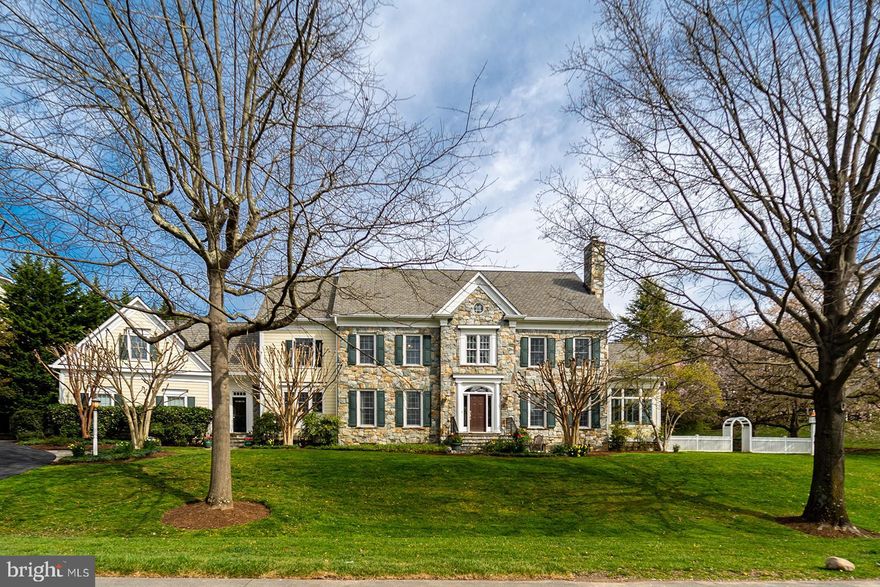 Welcome to 9824 Carmelita, a colonial masterpiece nestled in the heart of McAuley Park, a true sanctuary for those who value privacy and elegance. This magnificent home, a mere ten-minute drive from the bustling downtown Bethesda, is a testament to exquisite craftsmanship and thoughtful design.

Perched on a generous  half acre corner lot, Carmelita, built in 2001, stands majestically above street level, offering over 8,000 sq. ft. of luxurious living space. The grandeur of this home is truly something to behold, a testament to timeless elegance and sophisticated living.

As you enter from the freshly paved driveway, completed in March 2024, you are welcomed into a spacious mudroom that leads to a grand kitchen and breakfast area. This space seamlessly flows into an impressive great room adorned with built-in shelving, creating an atmosphere of warmth and hospitality.

The first floor boasts a meticulously planned layout, featuring an office just beyond the great room, a sunroom/den, and traditional living and dining rooms off the main foyer. The home offers six bedrooms, five upstairs and one on the lower level, ensuring ample space for family and guests.  Additionally, consider the upstairs bonus hobby room, situated just above the garage. It could easily serve as an additional bedroom.

The lower level is an entertainer’s dream, complete with a game room, gym, music room, and ample storage area. Freshly painted as of March 2024, the entire home exudes a sense of freshness and modernity.

The exterior of the home is just as impressive, with two refurbished patios and a fireplace off the back of the home, perfect for outdoor entertaining. The retaining walls have been entirely refurbished this spring, adding to the home’s appeal. A newly created stone walkway and gardens enhance the home’s timeless charm, creating a serene oasis.

Carmelita has been lovingly maintained and cared for over the years, a testament to its proud ownership. We invite you to tour this magnificent home today and make an offer that reflects its grandeur and timeless elegance. Welcome to your dream home. Welcome to Carmelita.