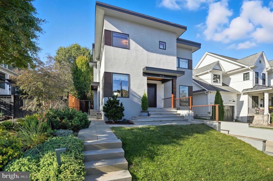 Nestled in the heart of coveted Lyon Village, this exceptional modern home—completely reimagined and extensively renovated in 2016—offers a seamless blend of refined design and everyday comfort. Just blocks from Clarendon’s vibrant dining, shopping, Metro, parks, and top-rated schools, this premier location delivers a walkable lifestyle with exceptional convenience while maintaining a quiet residential feel.   >>>   Inside, a light-filled, thoughtfully designed open layout is defined by soaring ceilings, white oak floors, and striking designer lighting. The dining room features custom cabinetry and carefully curated details, while a beautifully designed home office with built-ins offers both style and function. A thoughtfully designed mudroom with a separate entrance enhances daily living with ease.   >>>   At the heart of the home, the inviting living area showcases a gas fireplace and walls of windows that fill the space with natural light. The well-appointed chef’s kitchen is both refined and functional, featuring Elmwood cabinetry, sleek Dekton countertops, an oversized island, walk-in pantry, and a butler’s pantry with beverage center. A cozy banquette framed by steel windows overlooks the backyard, creating a warm and inviting space for casual dining.   >>>   Upstairs, the serene primary suite offers two custom walk-in closets and a spa-inspired bath with an oversized shower and bench seating. A sunlit ensuite bedroom, two additional bedrooms connected by a Jack-and-Jill bath, and a conveniently located laundry room complete the upper level.   >>>   The lower level impresses with a spacious recreation room ideal for relaxing or exercising, a guest bedroom, full bath, second laundry area, and direct access to the attached garage.   >>>   Outside, professionally landscaped grounds, flagstone walkways, and a private patio create a peaceful setting for both entertaining and everyday living.   >>>   Lyon Village is known for its welcoming, well-established community and timeless appeal, offering no formal HOA while maintaining a strong neighborhood connection through beloved annual events such as the 4th of July parade and local gatherings. This is more than a home—it’s a lifestyle opportunity in one of Arlington’s most desirable neighborhoods, offering the perfect balance of comfort, design, and location.