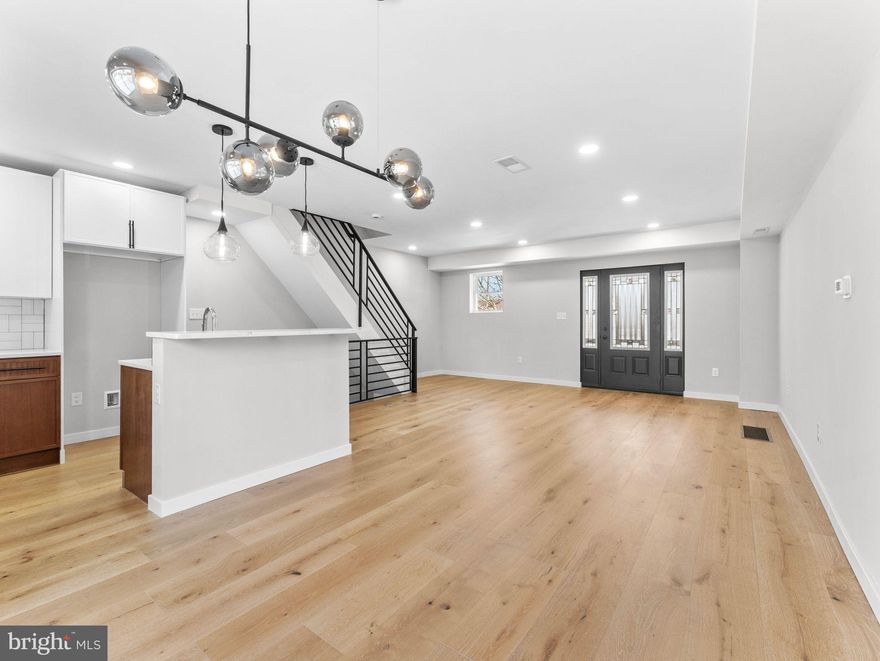 Discover the perfect blend of modern luxury and neighborhood charm in this stunning 3-bedroom, 2-bath townhome, welcome to 347 E. Montana Street. Located on one of Mt. Airy’s coveted tree-lined streets, you are just steps away from local coffee shops, eclectic dining, and the lush trails of the Wissahickon. The open-concept main level welcomes you with brand-new luxury hardwood floors and recessed lighting throughout. The chef-inspired kitchen is the heart of the home, featuring a sophisticated mix of white and oak soft-close shaker cabinetry, a convenient breakfast bar, and sleek finishes. Host dinner parties in the seamless dining area, or slide open the glass doors to enjoy your morning coffee on a generously sized rear deck. The finished lower level offers a versatile living area and a modern bathroom with a spa-like oversized shower. Whether you’re relaxing on your covered front patio or commuting via nearby Lincoln Drive, this home offers an unparalleled Philadelphia lifestyle. Schedule your private tour today!