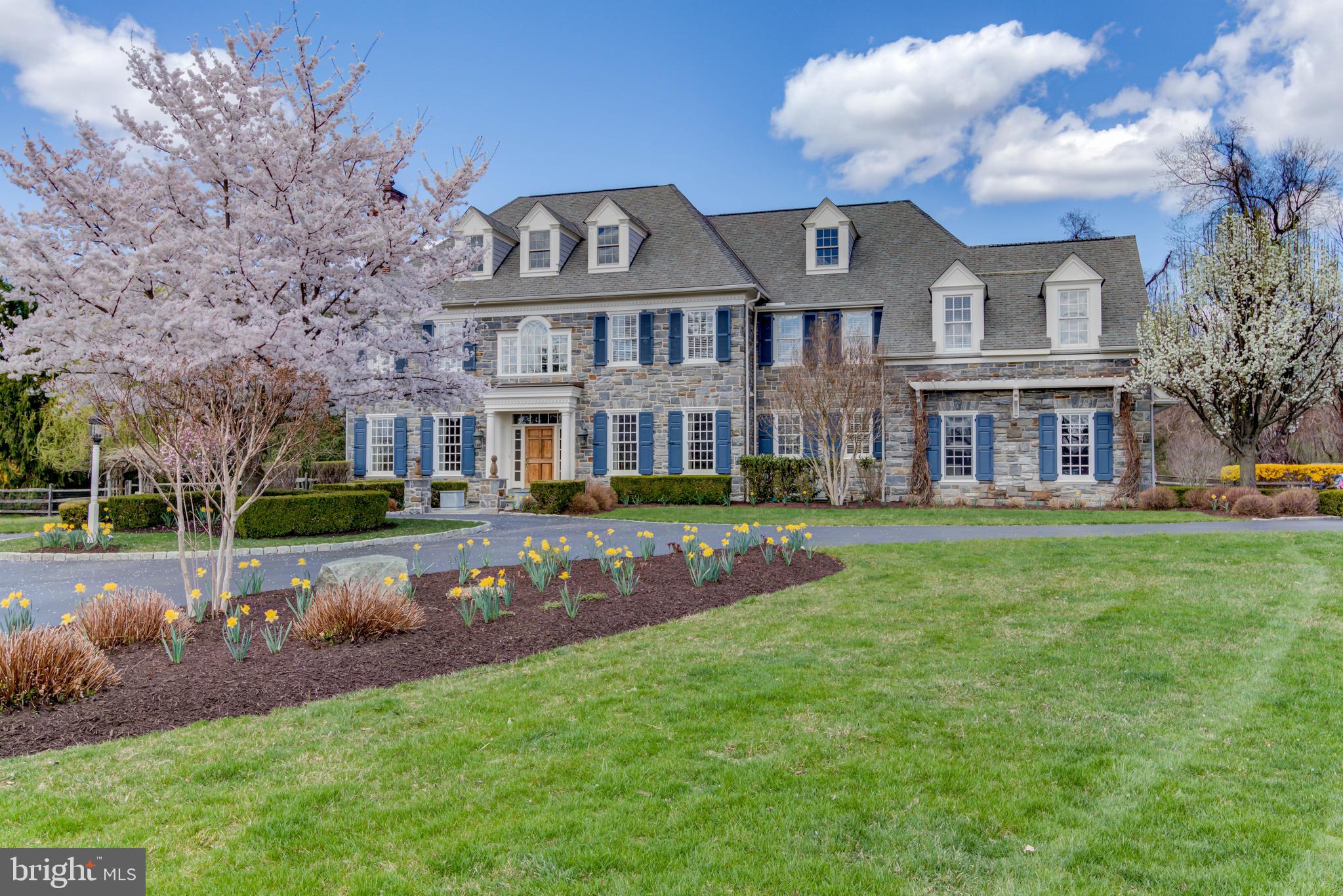 Welcome to this Outstanding Colonial Manor Home situated on a highly desirable 1.7 acre level lot on a cul-de-sac with breathtaking views of the pool and and beautiful fountain featured in the magnificent rear grounds of the property. Custom built by Drueding Builders, this desirable Cheswold model features four finished floors of living space, with additional space on the lower level to expand. Exterior features include stone facade, Hardy Board Siding, circular cobblestoned driveway, beautiful flagstone walkways and expanded patios with custom heated pool with rock waterfall, elegant water fountains, extensive professional landscaping with exterior lighting. Interior features include beautiful hardwood floors, three fireplaces, extensive custom millwork, arched entryways, Formal Living and Dining Rooms, gourmet Kitchen, an elegant master suite with sitting room and lavish master bath, finished third floor suite, and a spacious partially finished lower level. Custom details abound thruout to make this home the perfect place for entertaining and active family living. This central location is just minutes from 422 corporate centers, King of Prussia, Malvern, Paoli and Wayne for local shopping and dining and is within close proximity to all major roadways for commuting to Center City or the airport.