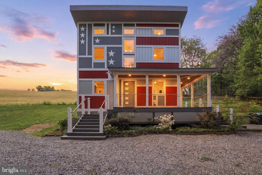Welcome to 293 Grove Rd, Delta, PA — better known as The Flag House, one of the most unique and memorable homes to hit the market in southern Pennsylvania. This striking contemporary retreat blends bold character, modern comfort, and outdoor adventure into one incredible opportunity. Designed with an exterior inspired by the American flag, this home is truly a landmark all its own.

Built in 2015, this 2 bedroom, 1.5 bath home offers approximately 1,050 square feet of thoughtfully designed living space featuring soaring ceilings, warm hardwood floors, an updated kitchen, propane fireplace, first-floor laundry, and a convenient mudroom. Efficient ductless mini-split heating and cooling provides year-round comfort, while the durable metal siding and roof add style and low-maintenance appeal.

Step outside and enjoy the charm of the wraparound porch, perfect for morning coffee or evening relaxation, along with a fenced side yard ideal for pets, entertaining, or simply enjoying the peaceful setting. 

Located near the Susquehanna River, outdoor enthusiasts will love easy access to boating, fishing, kayaking, and hiking. Just minutes away, Starrk Moon Kayaks offers local paddling adventures and river fun, while nearby parks, trails, and small-town charm make this a destination worth experiencing year-round. 

Whether you’re searching for a weekend getaway, full-time residence, Airbnb investment, or a one-of-a-kind retreat for nature lovers, The Flag House delivers something truly special.