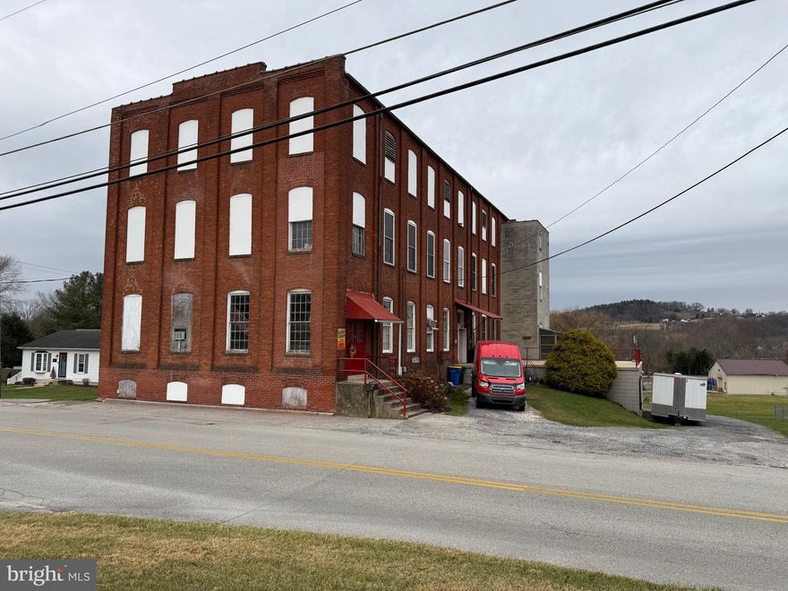 See the potential in this mixed use commercial building! 4 floors, multiple entrances, and a great location, This property has a floor set up as a luxury apartment and features lots of unique spaces that could facilitate many types of businesses.